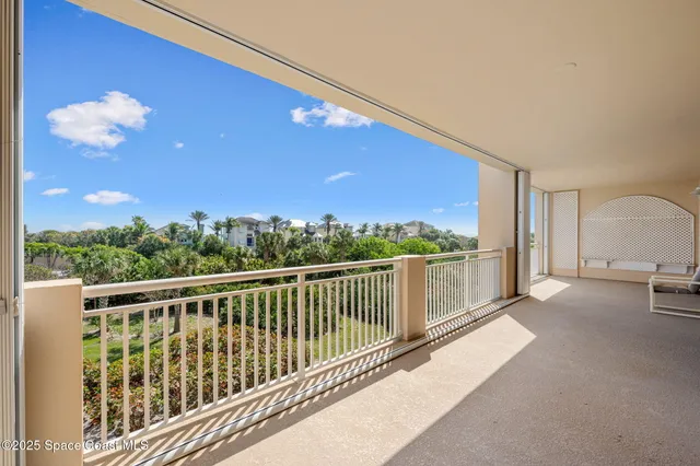 a view of porch with a floor to ceiling window and wooden floor