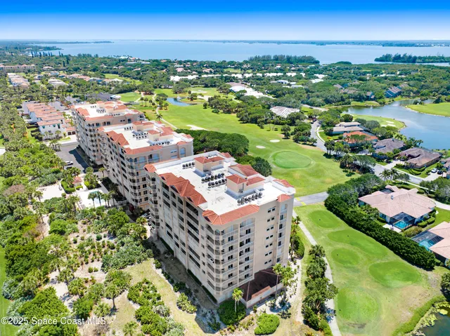 a view of parking garage with cars parked