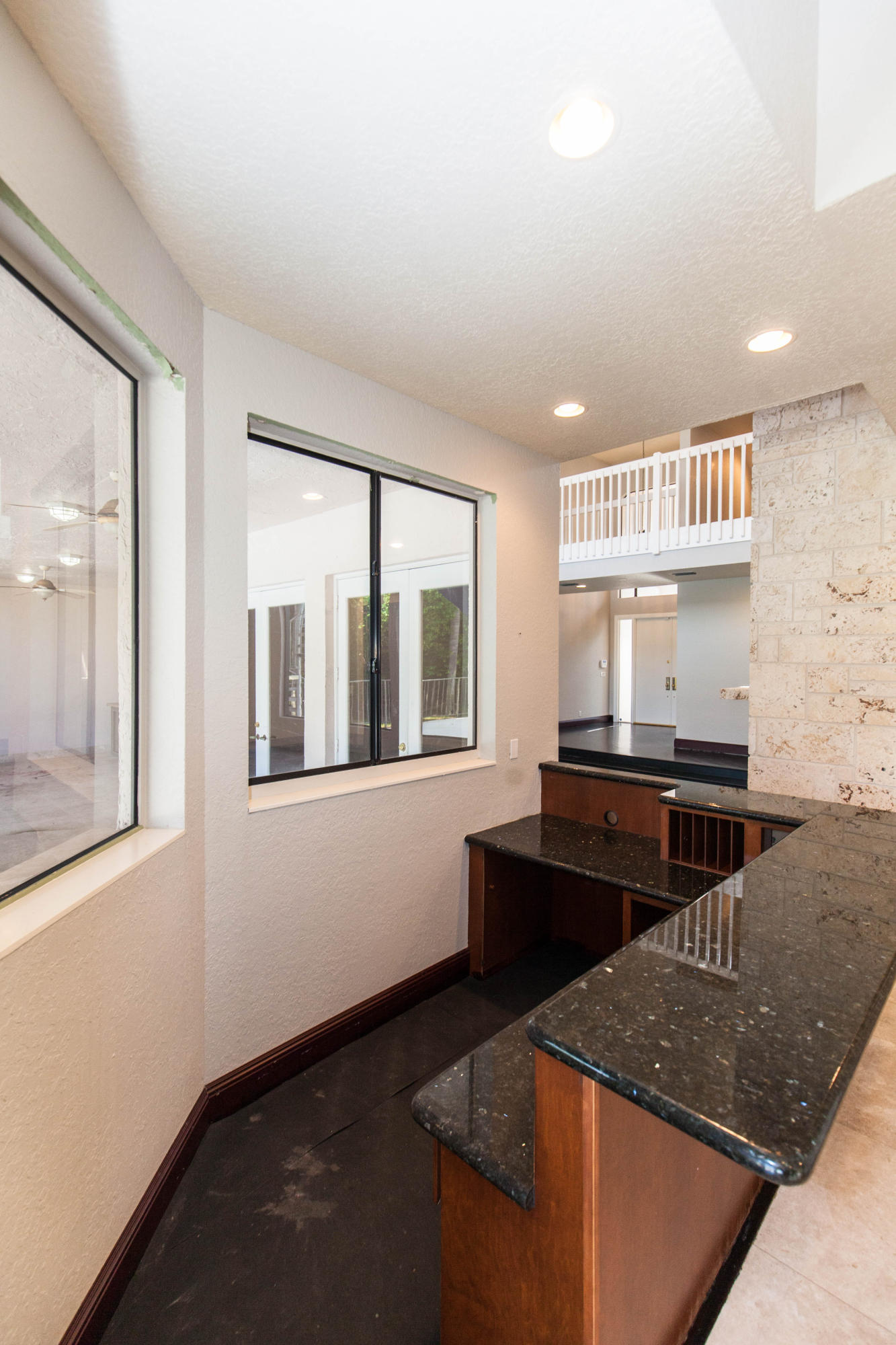 6087 Northwest 23rd Terrace Boca Raton, FL 33496 - Photo 18 of 64 a kitchen with granite countertop a stove and a sink