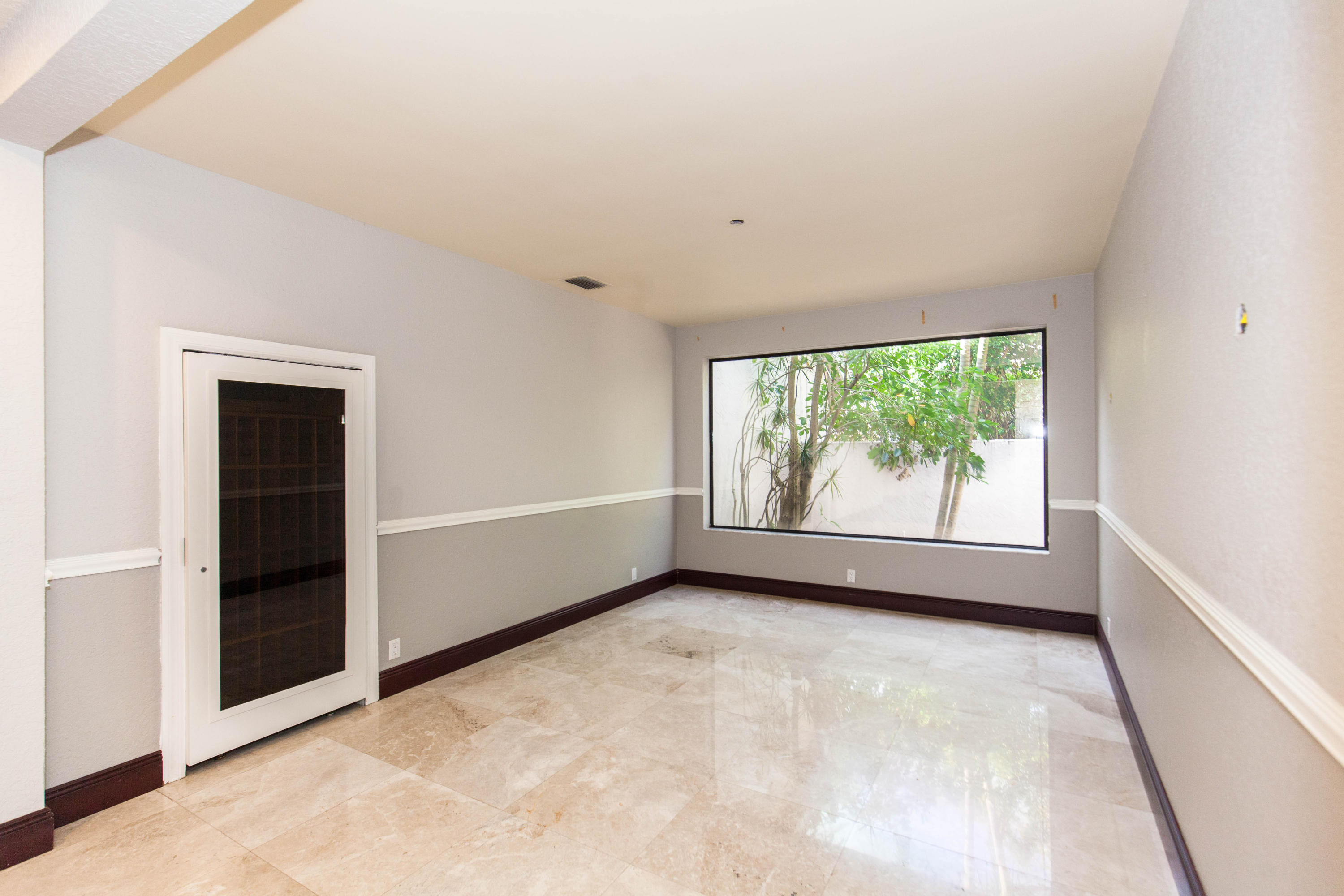6087 Northwest 23rd Terrace Boca Raton, FL 33496 - Photo 20 of 64 an empty room with windows