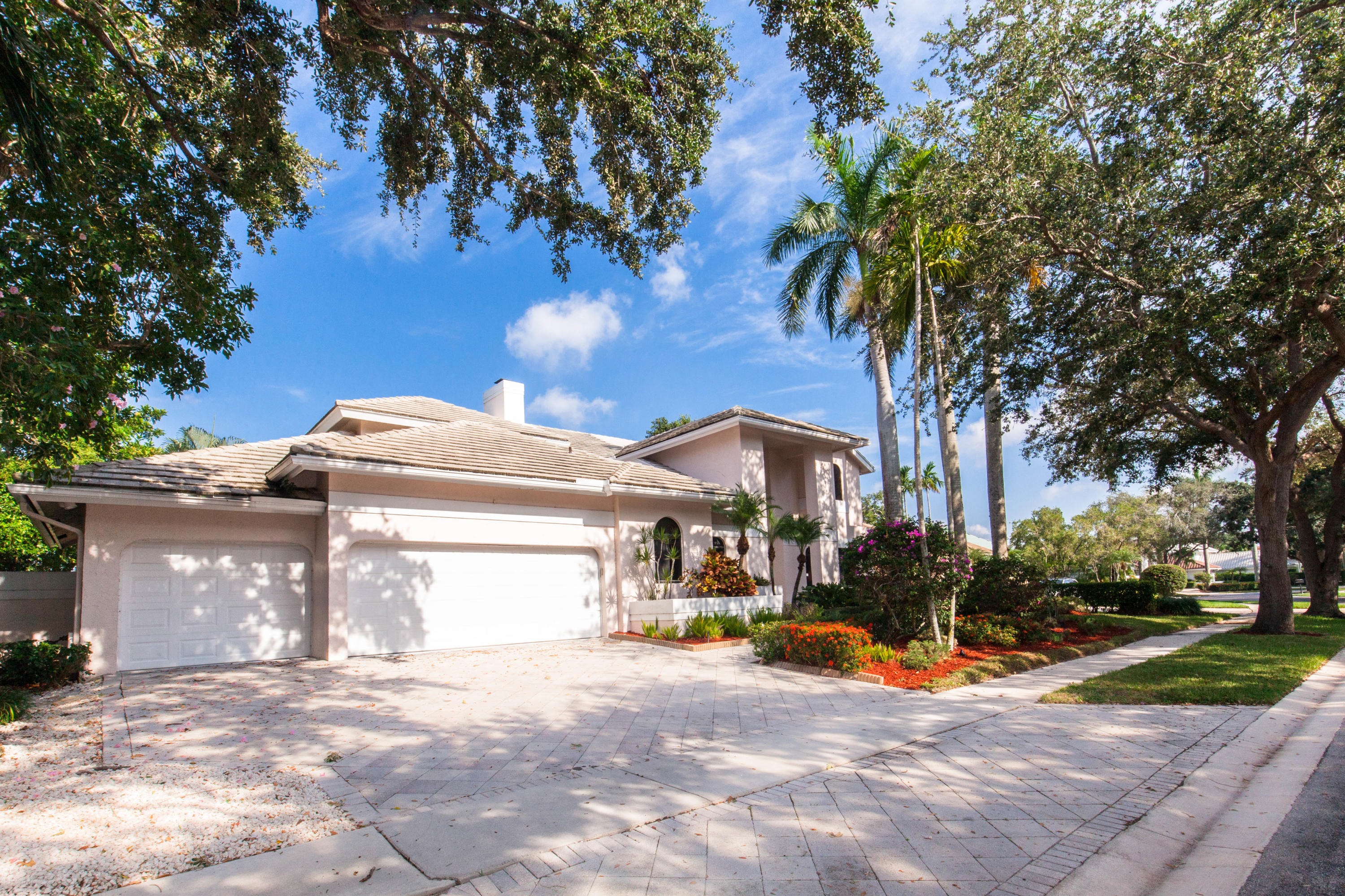 6087 Northwest 23rd Terrace Boca Raton, FL 33496 - Photo 2 of 64 a view of a house with a yard and large tree