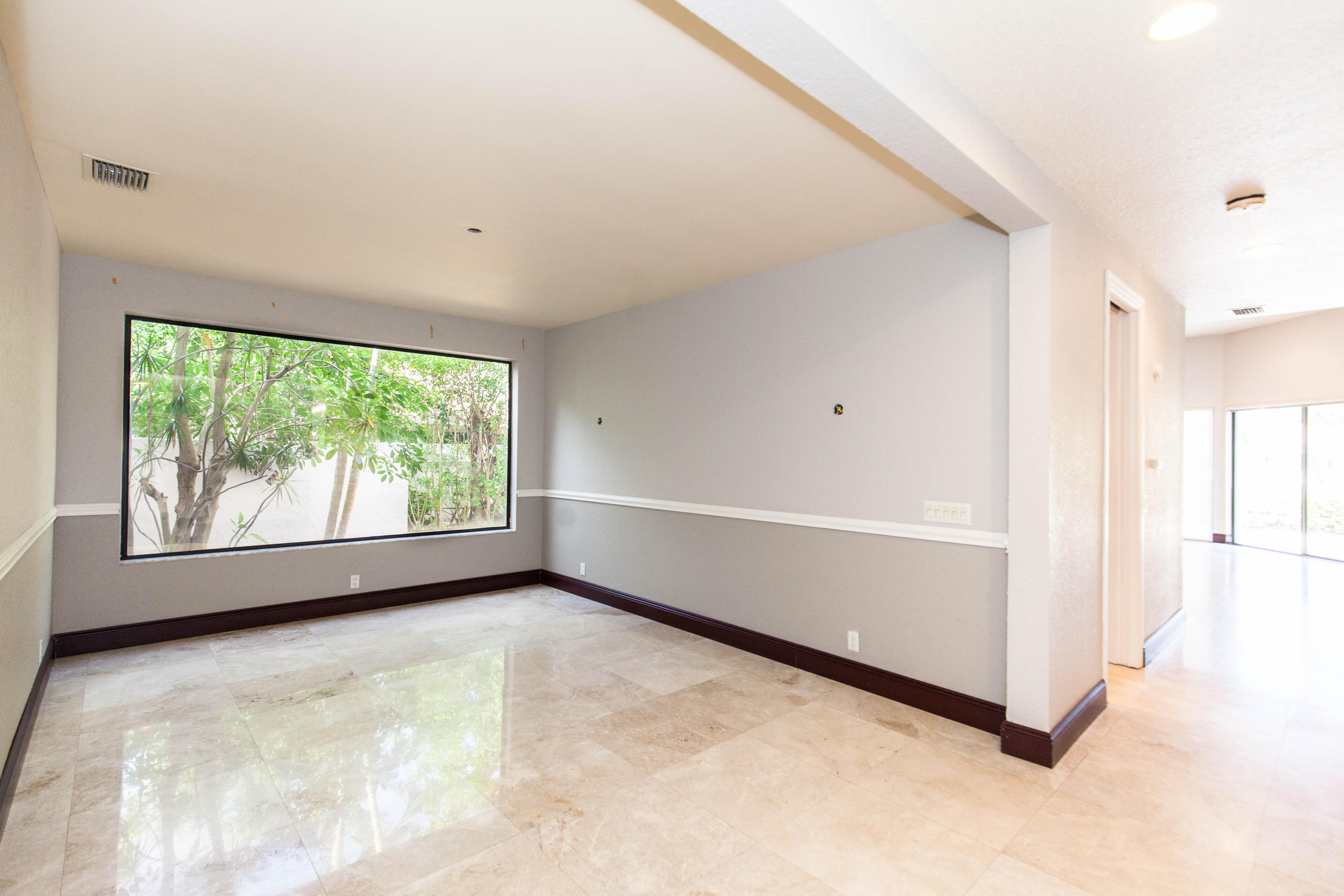 6087 Northwest 23rd Terrace Boca Raton, FL 33496 - Photo 21 of 64 a view of an empty room with a window