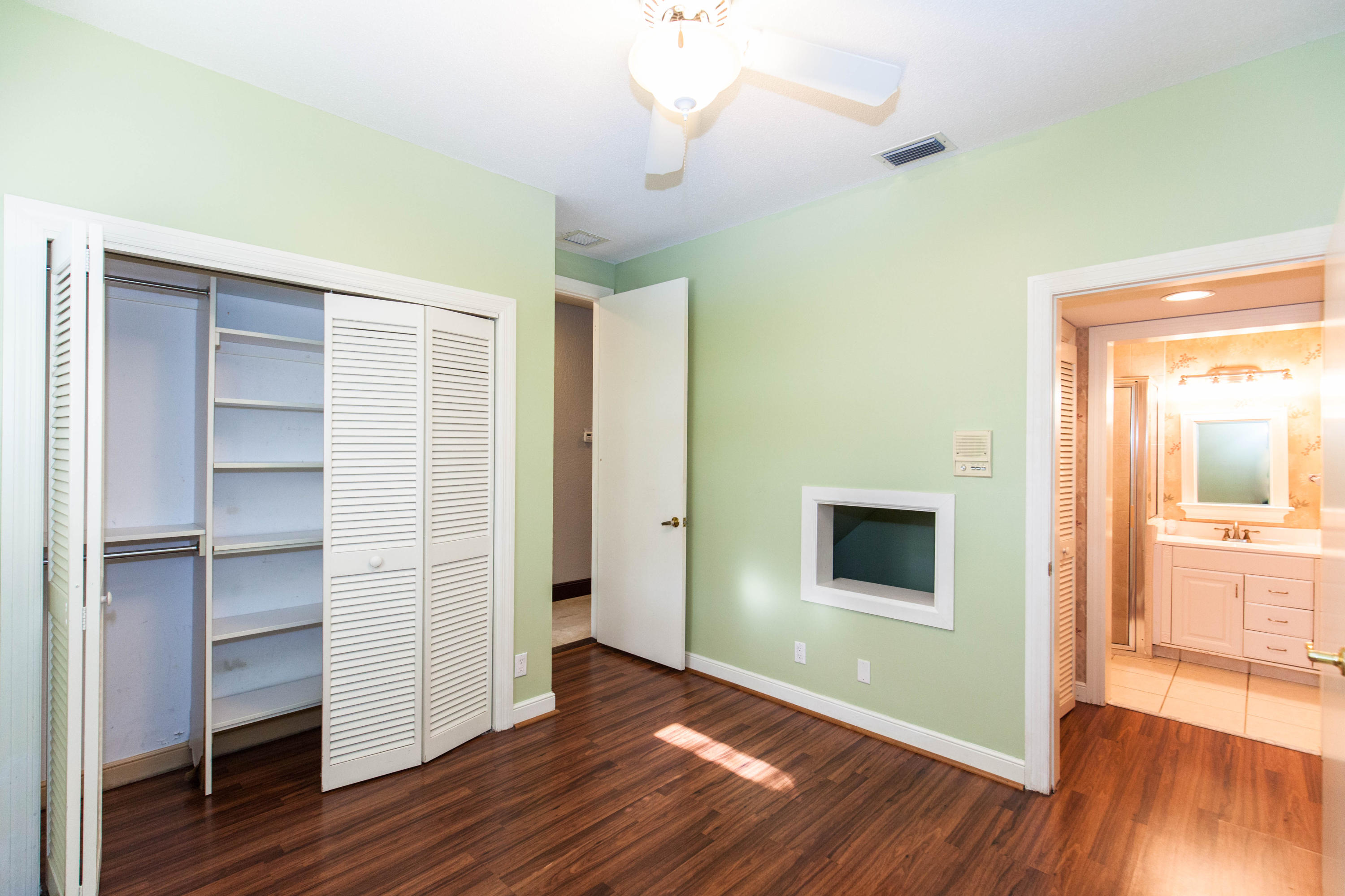 6087 Northwest 23rd Terrace Boca Raton, FL 33496 - Photo 25 of 64 a view of a room with wooden floor closet and windows
