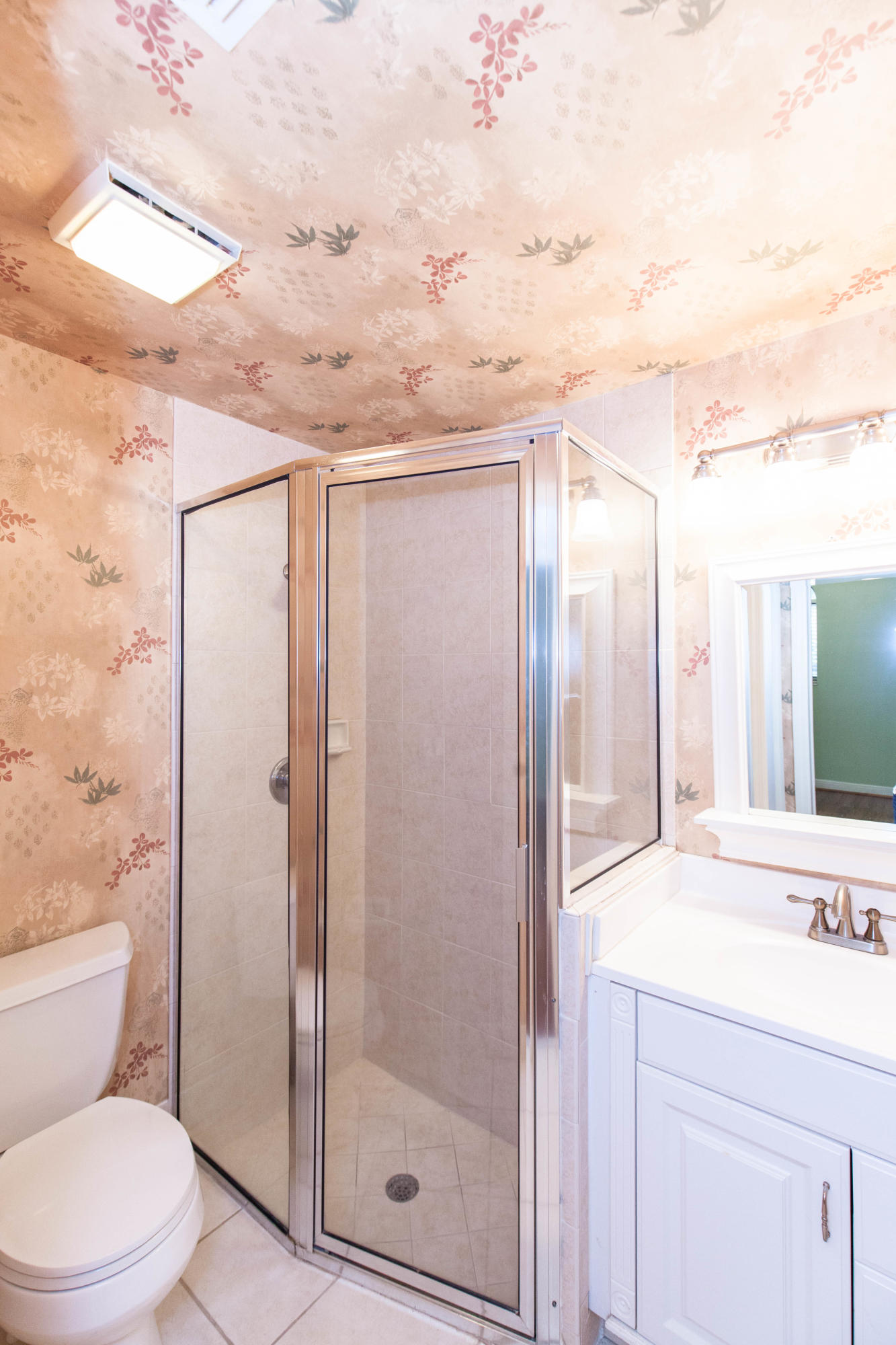 6087 Northwest 23rd Terrace Boca Raton, FL 33496 - Photo 27 of 64 a bathroom with a granite countertop sink a toilet and shower