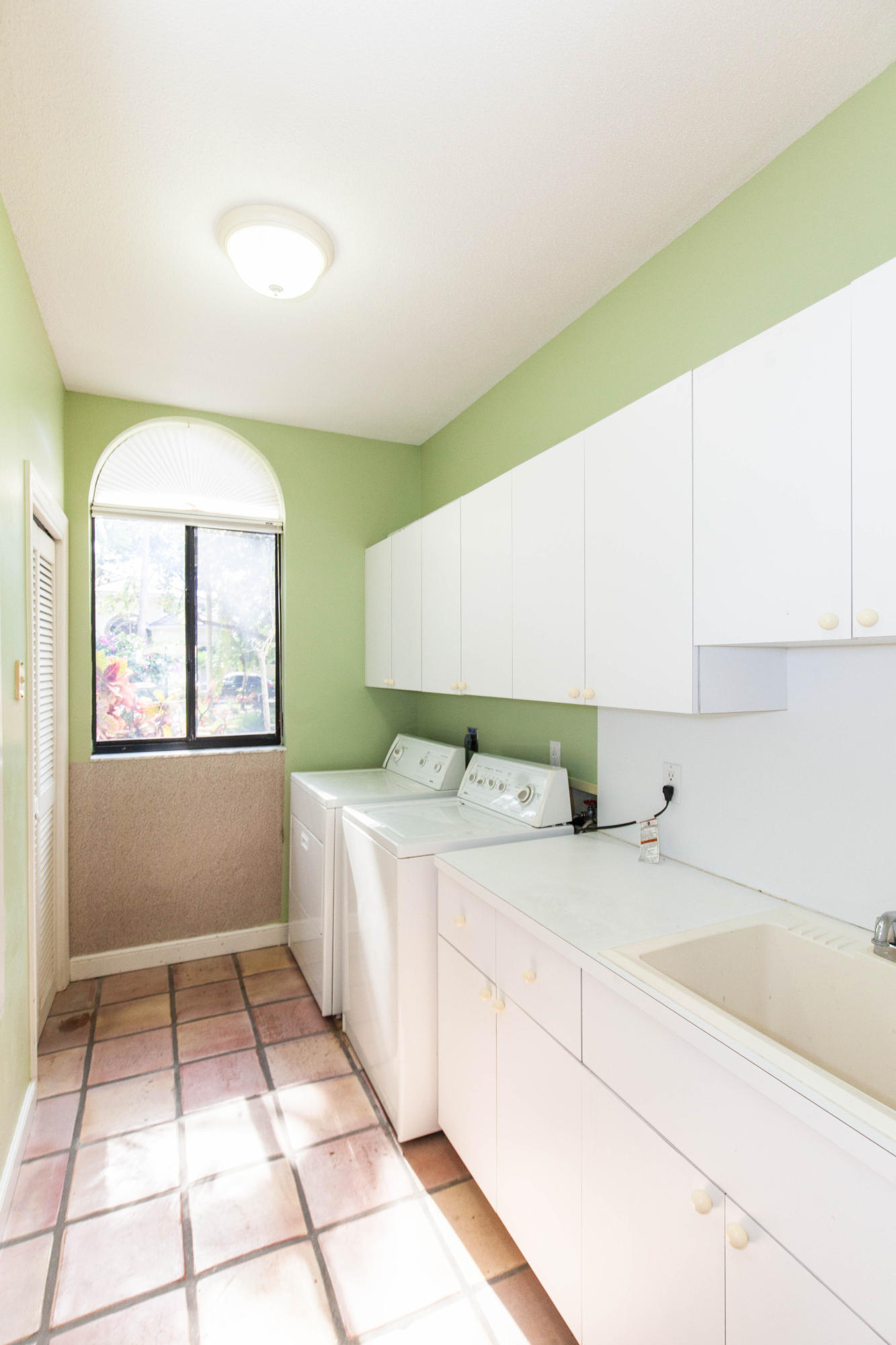 6087 Northwest 23rd Terrace Boca Raton, FL 33496 - Photo 28 of 64 a kitchen with a sink and cabinets