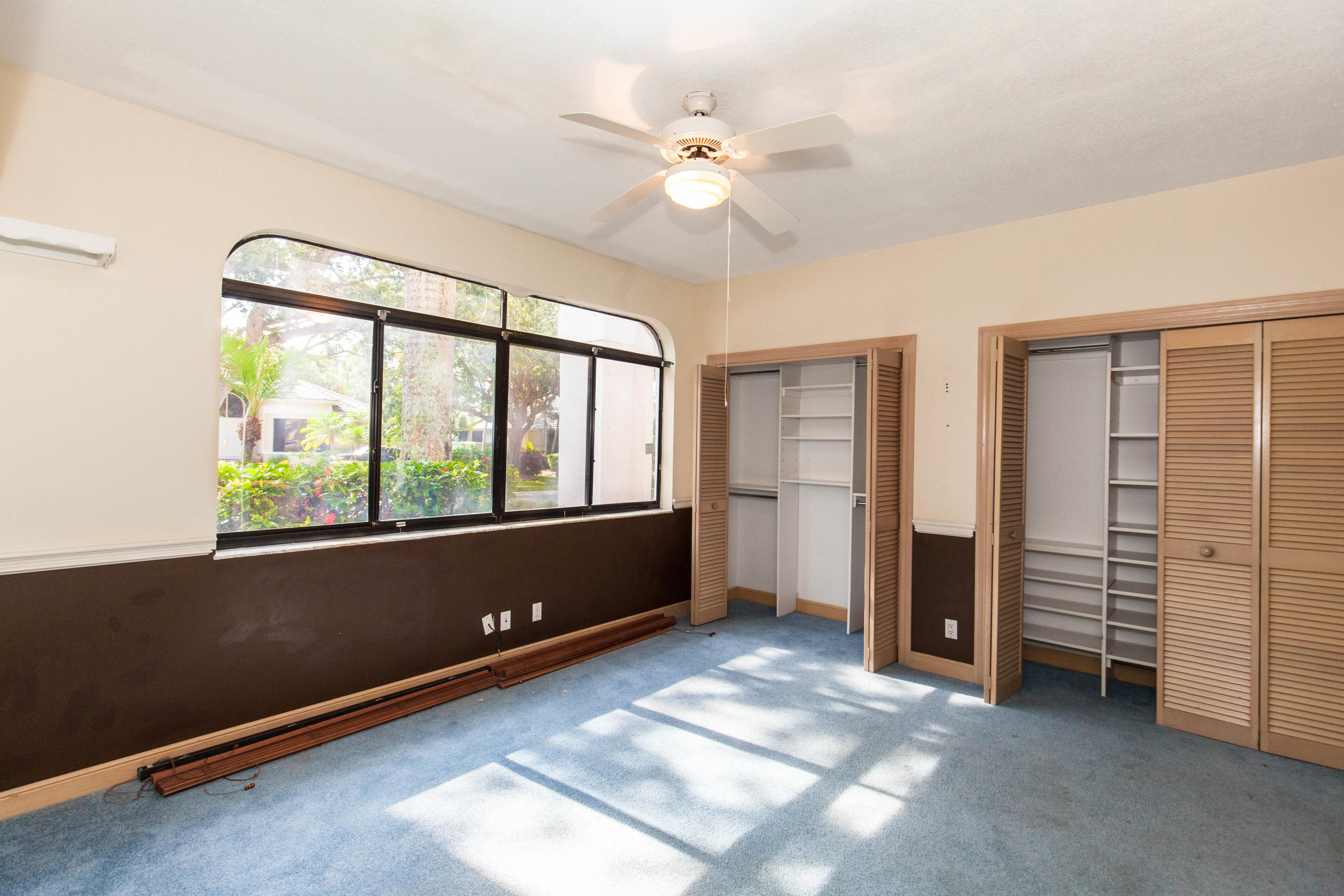 6087 Northwest 23rd Terrace Boca Raton, FL 33496 - Photo 35 of 64 wooden floor and window in an empty room