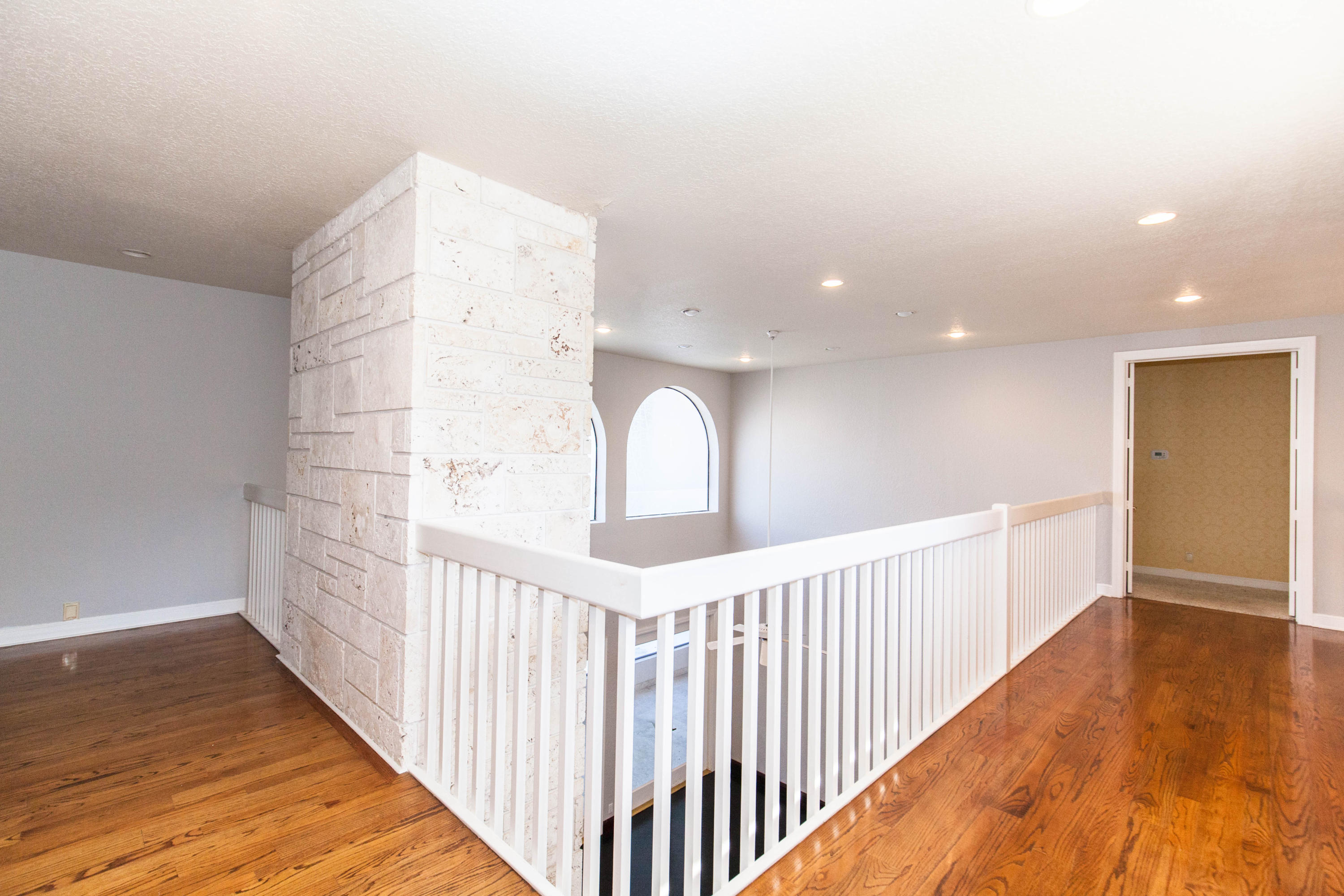6087 Northwest 23rd Terrace Boca Raton, FL 33496 - Photo 38 of 64 a view of a hallway with wooden floor