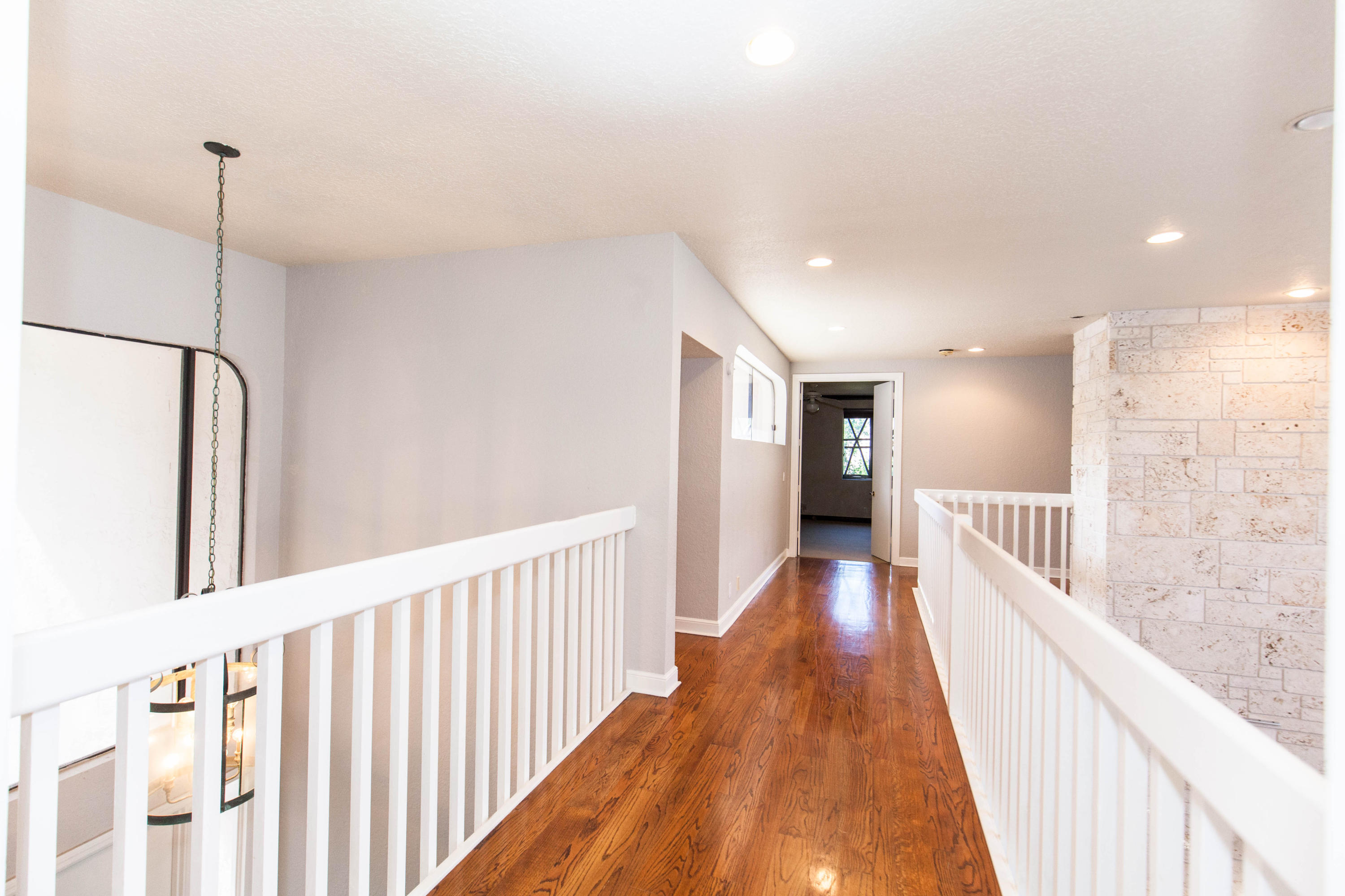 6087 Northwest 23rd Terrace Boca Raton, FL 33496 - Photo 39 of 64 a view of a hallway with wooden floor