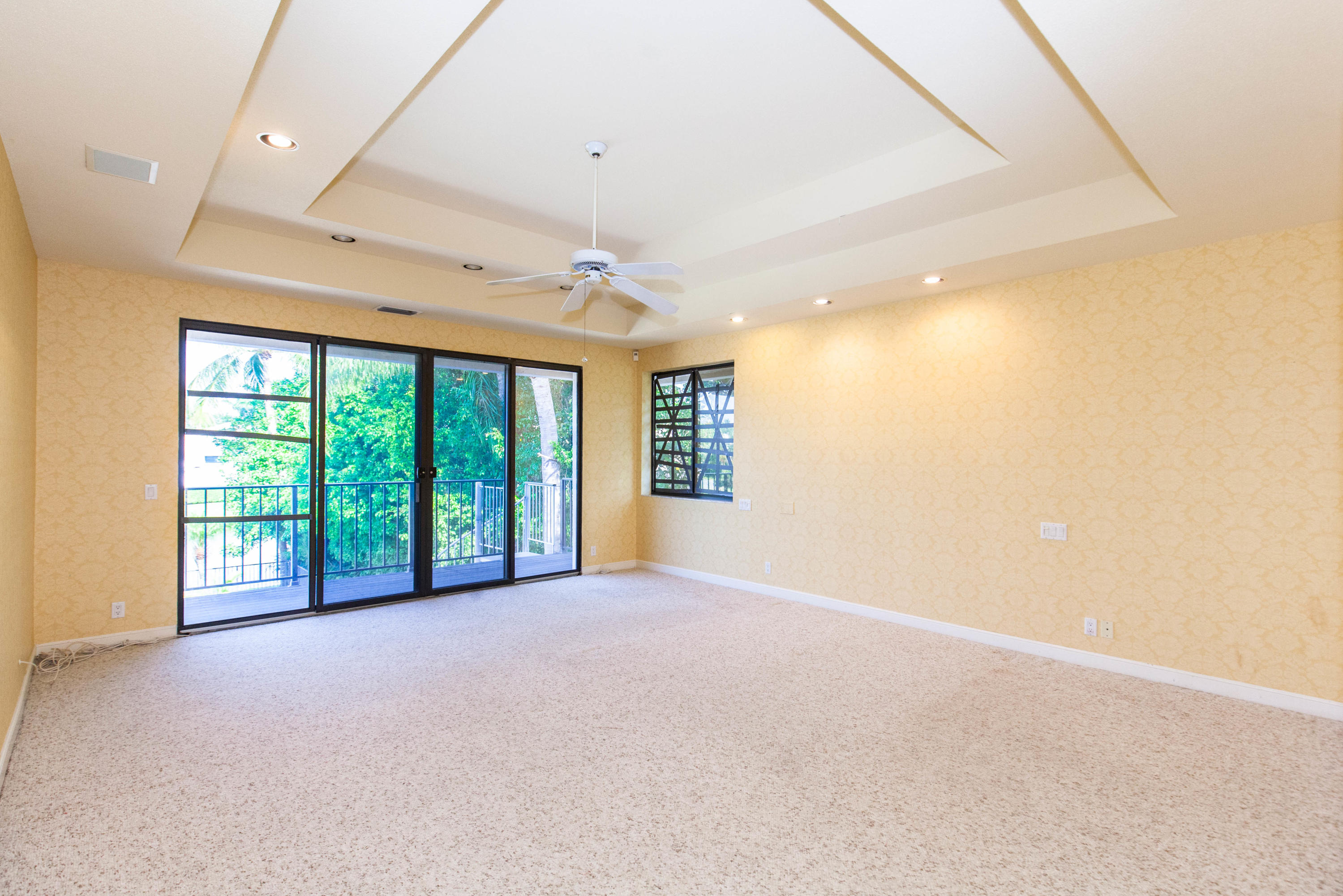 6087 Northwest 23rd Terrace Boca Raton, FL 33496 - Photo 40 of 64 an empty room with windows