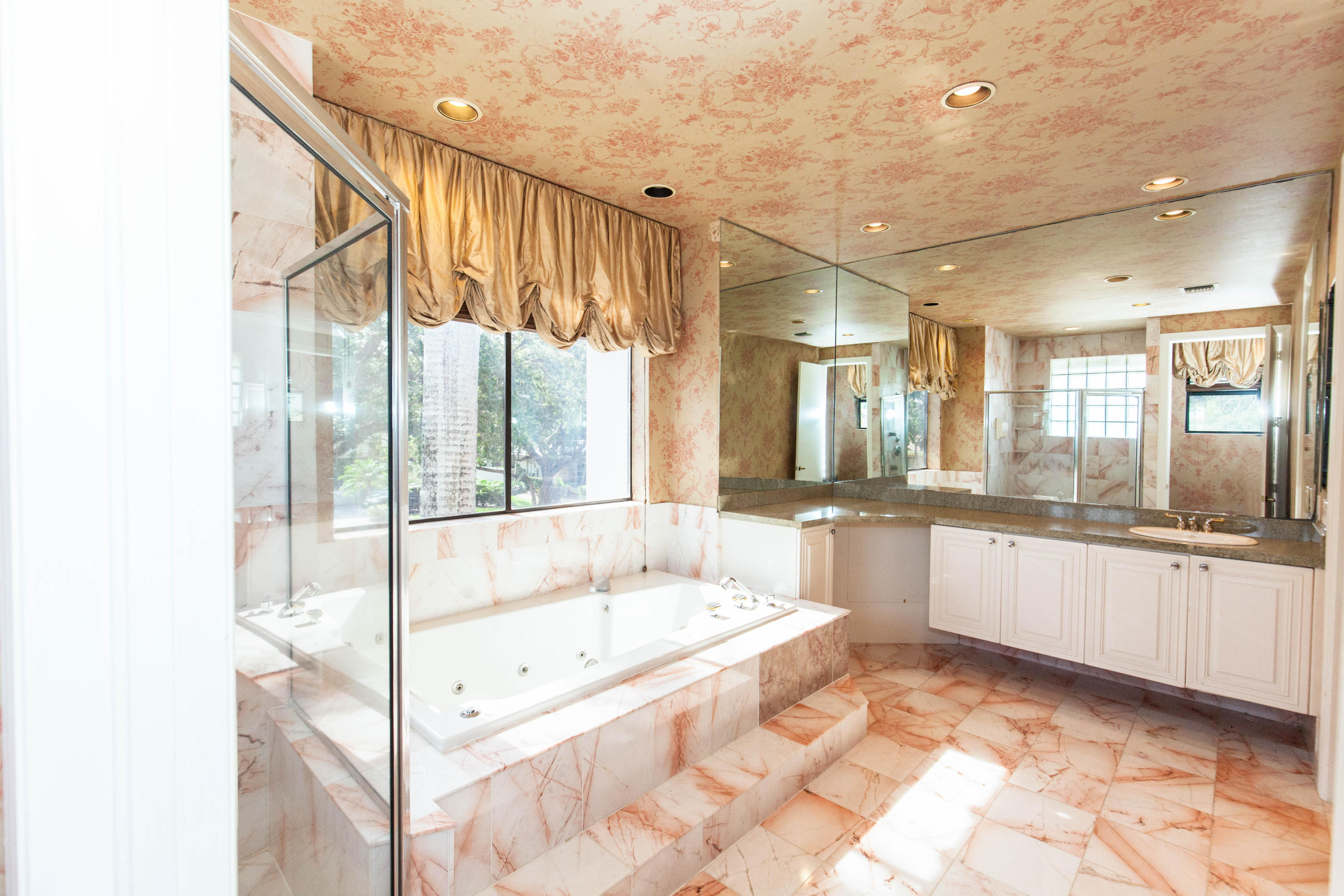 6087 Northwest 23rd Terrace Boca Raton, FL 33496 - Photo 44 of 64 a large spacious bathroom with a large tub and shower
