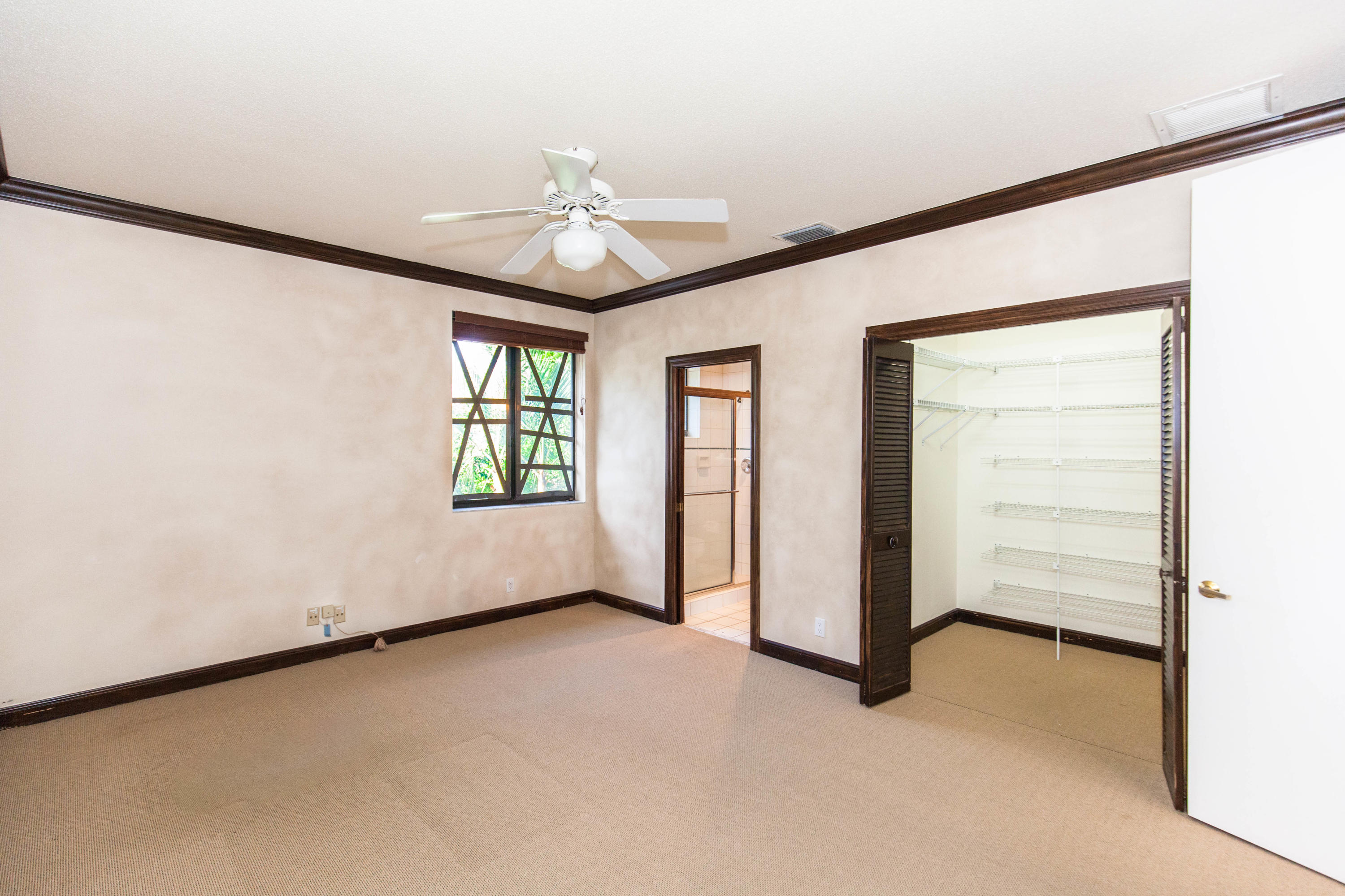 6087 Northwest 23rd Terrace Boca Raton, FL 33496 - Photo 49 of 64 an empty room with windows and closet