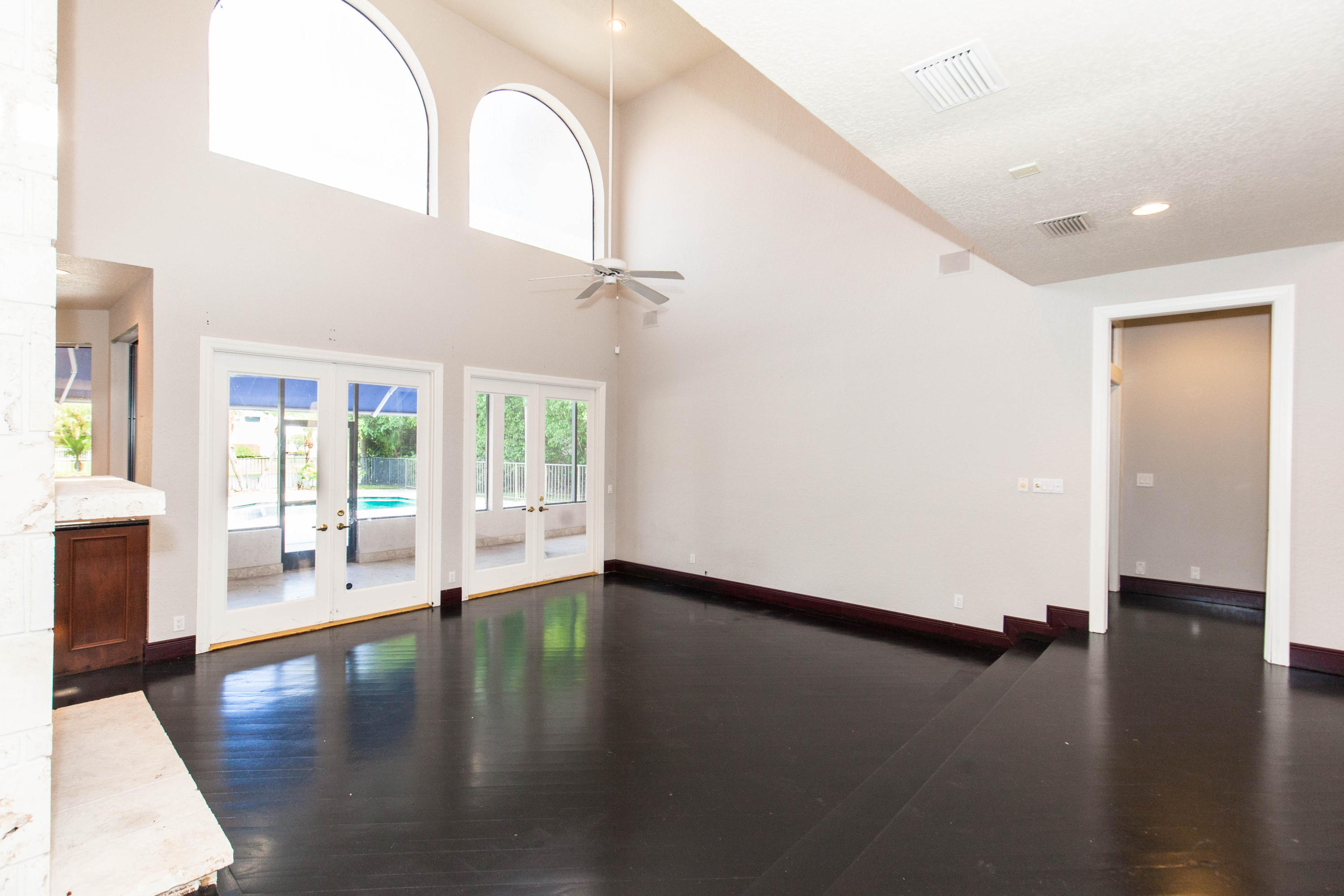 6087 Northwest 23rd Terrace Boca Raton, FL 33496 - Photo 5 of 64 a view of livingroom with hardwood floor and a ceiling fan