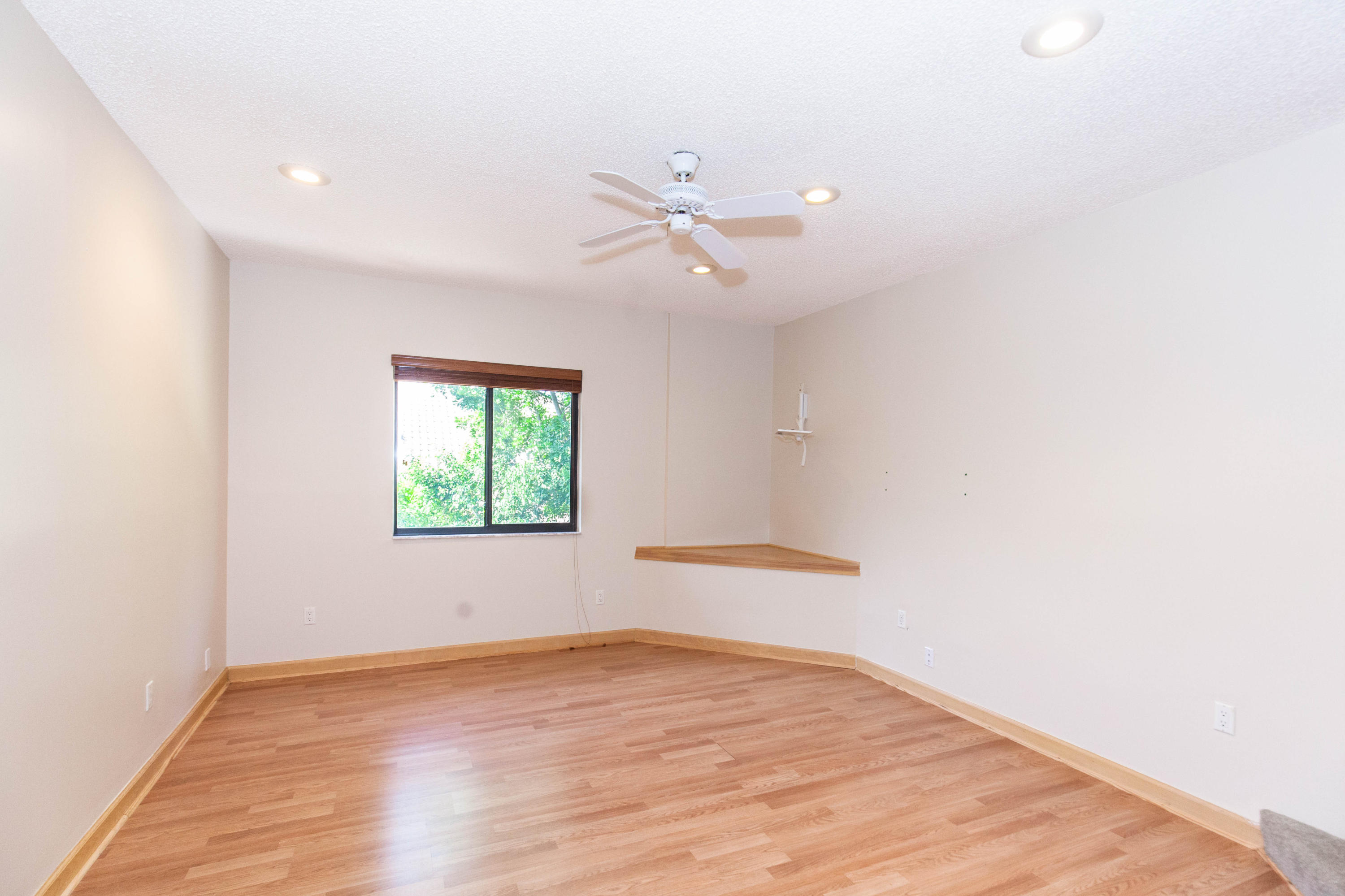 6087 Northwest 23rd Terrace Boca Raton, FL 33496 - Photo 52 of 64 wooden floor in an empty room with a window