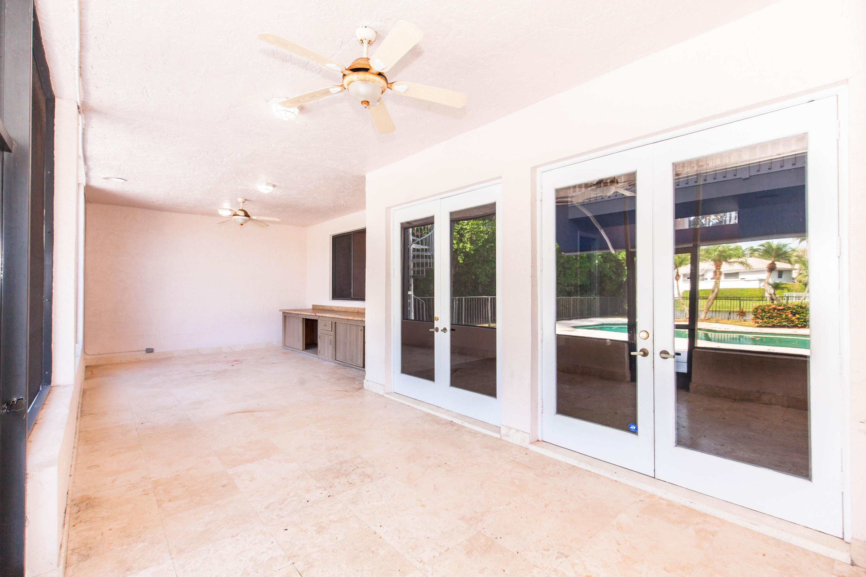 6087 Northwest 23rd Terrace Boca Raton, FL 33496 - Photo 55 of 64 a view of an empty room with a kitchen