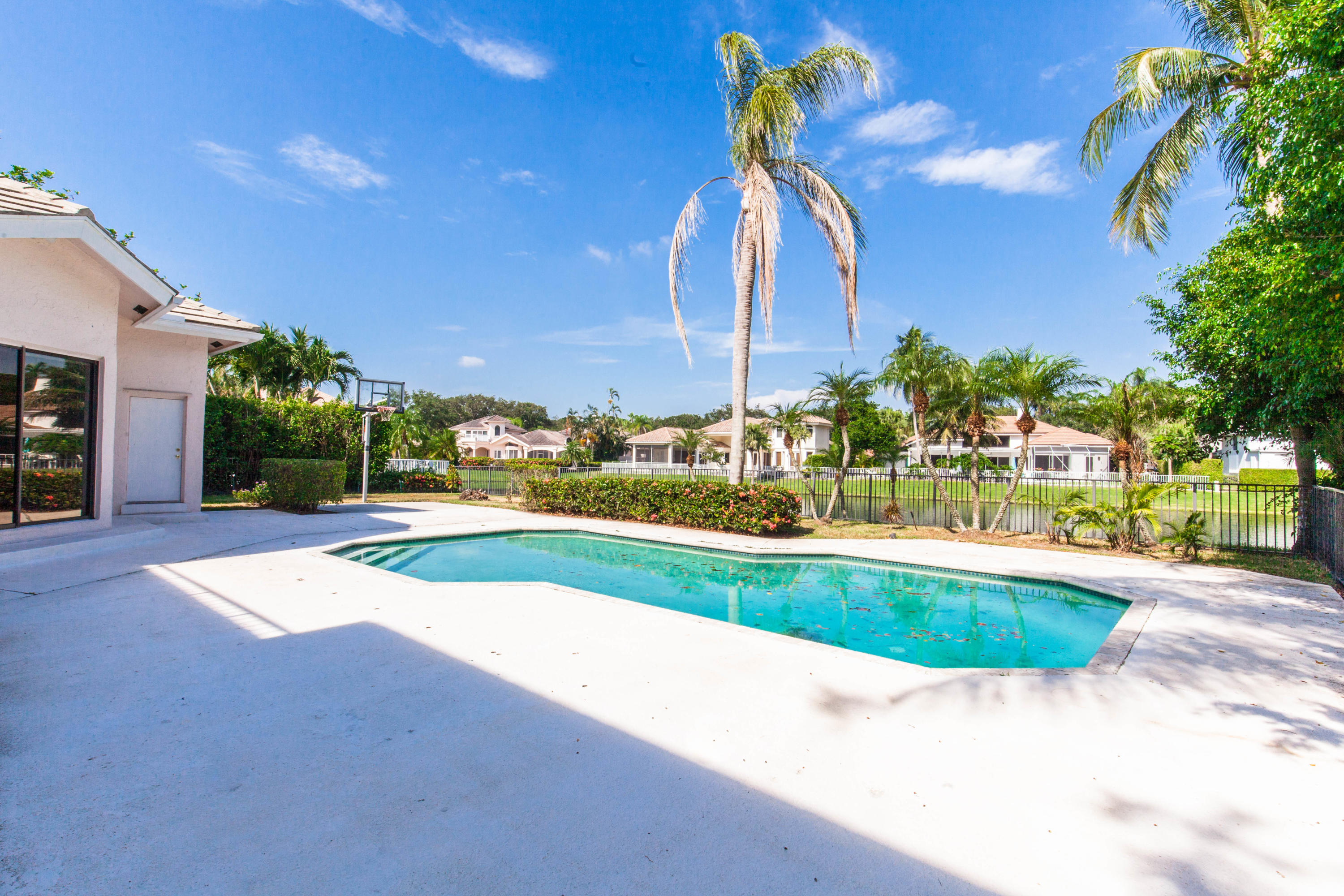 6087 Northwest 23rd Terrace Boca Raton, FL 33496 - Photo 59 of 64 a view of swimming pool is middle in the garden