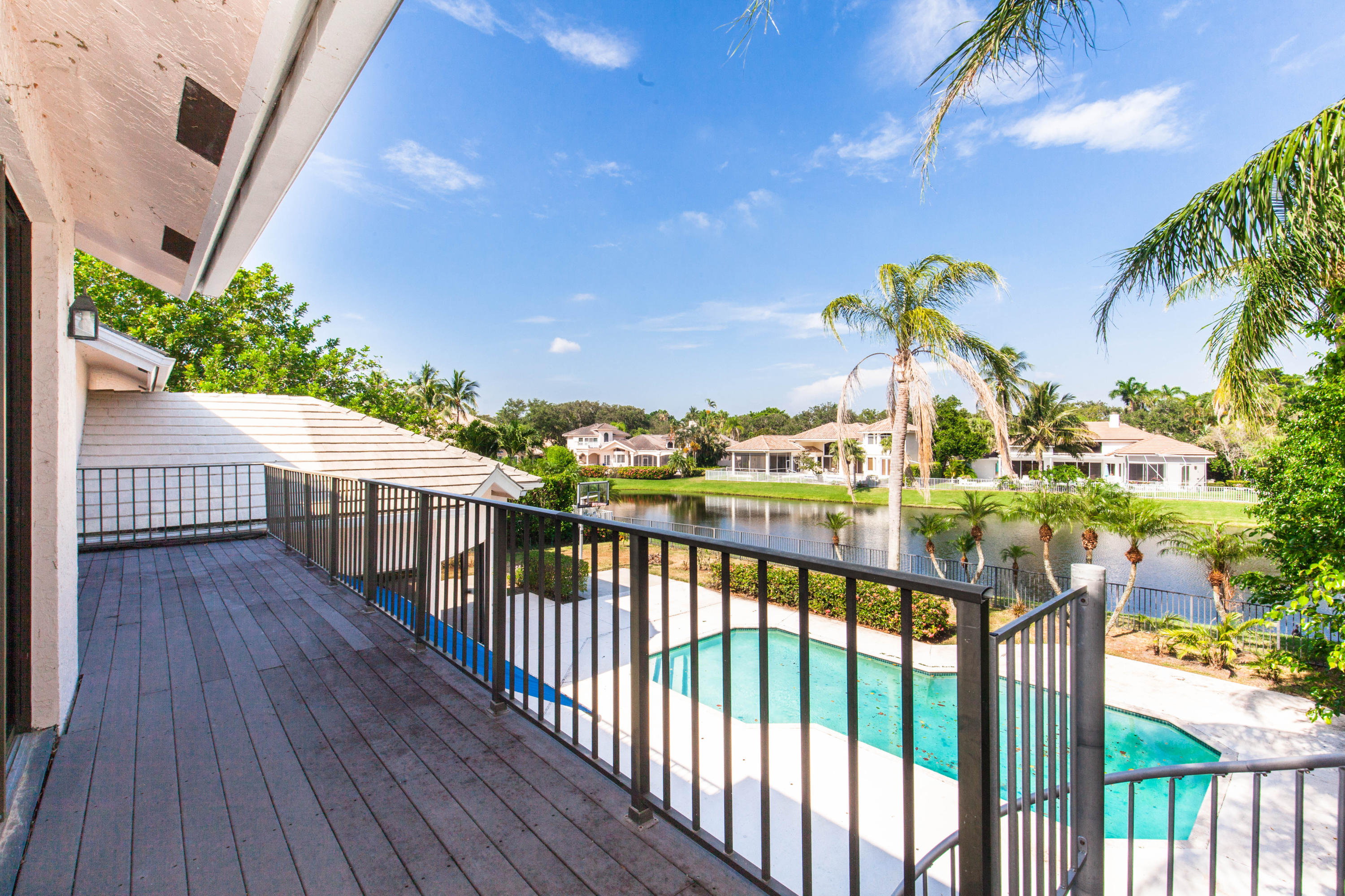 6087 Northwest 23rd Terrace Boca Raton, FL 33496 - Photo 60 of 64 a view of a balcony with wooden floor
