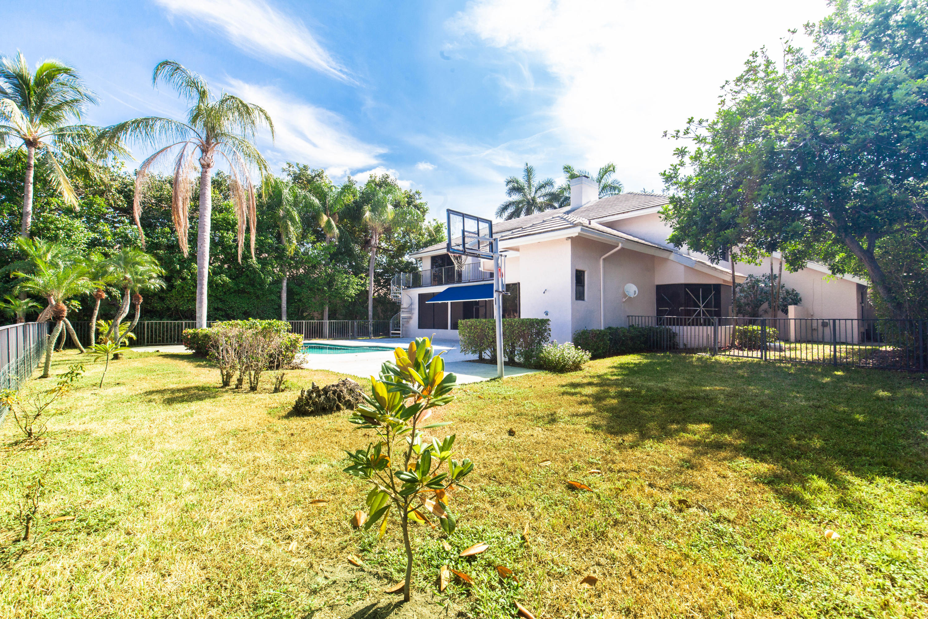 6087 Northwest 23rd Terrace Boca Raton, FL 33496 - Photo 62 of 64 a view of a house with a yard