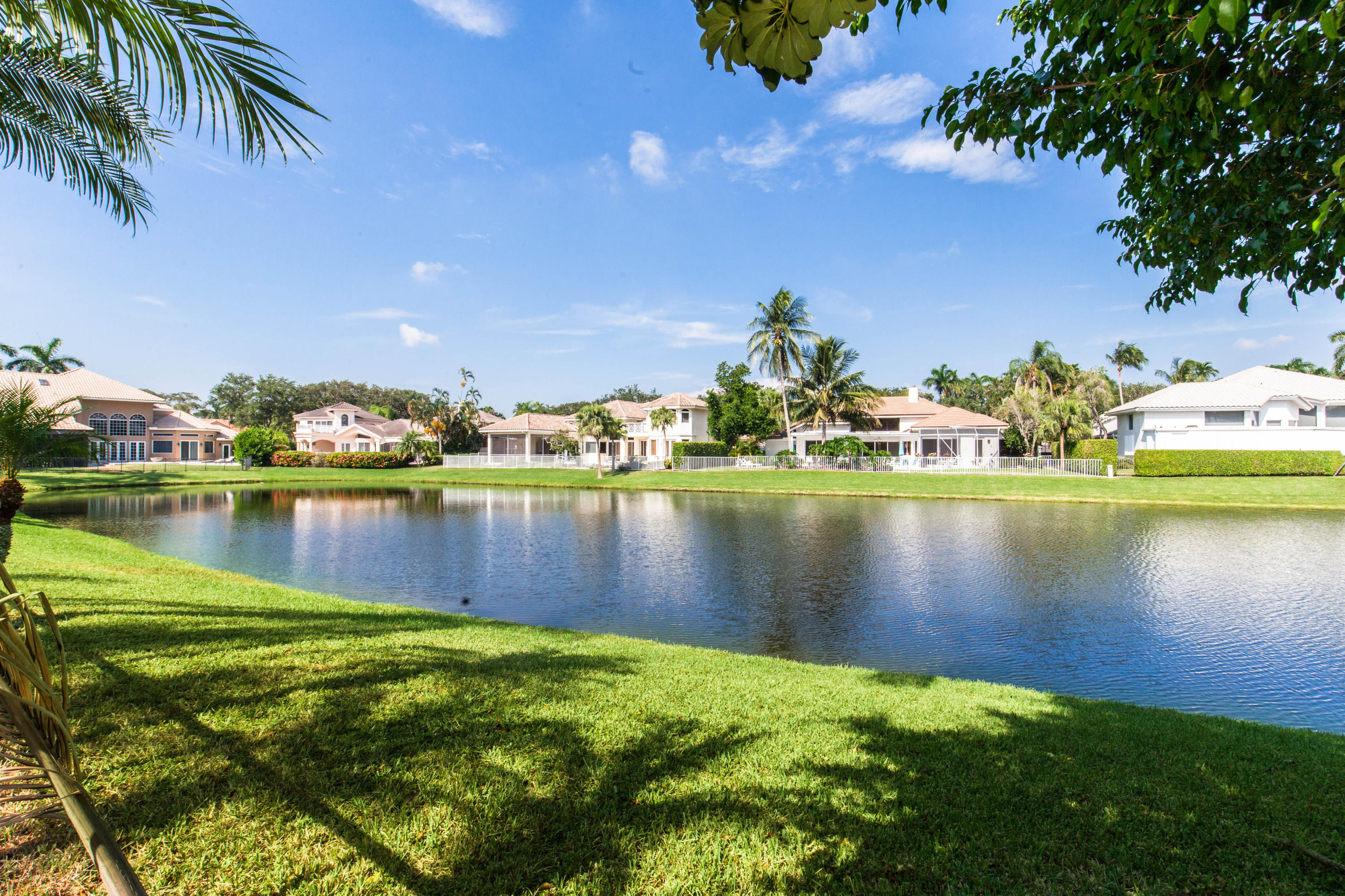 6087 Northwest 23rd Terrace Boca Raton, FL 33496 - Photo 63 of 64 a view of a lake with houses in the back