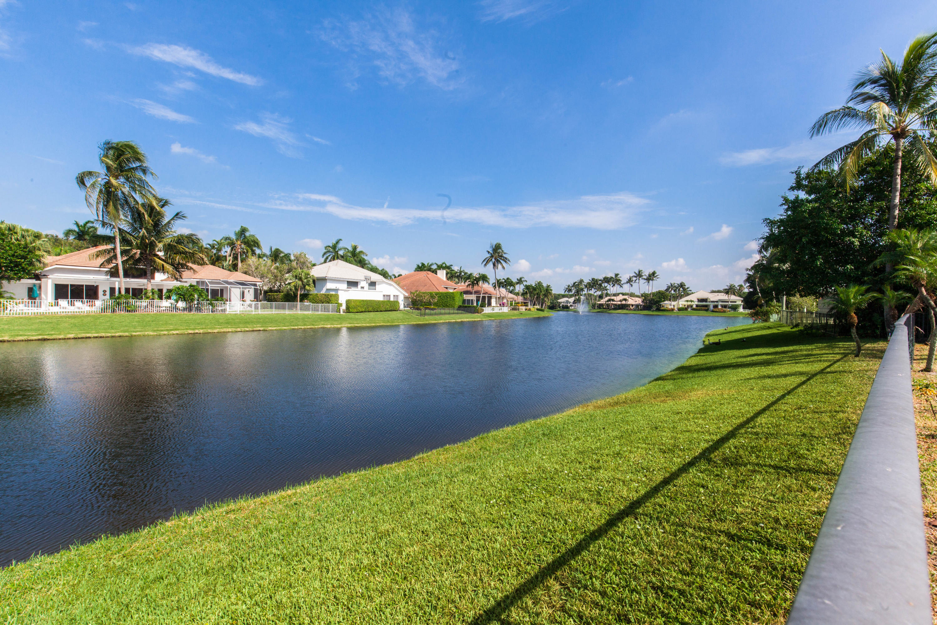 6087 Northwest 23rd Terrace Boca Raton, FL 33496 - Photo 64 of 64 a view of a lake with houses in the back