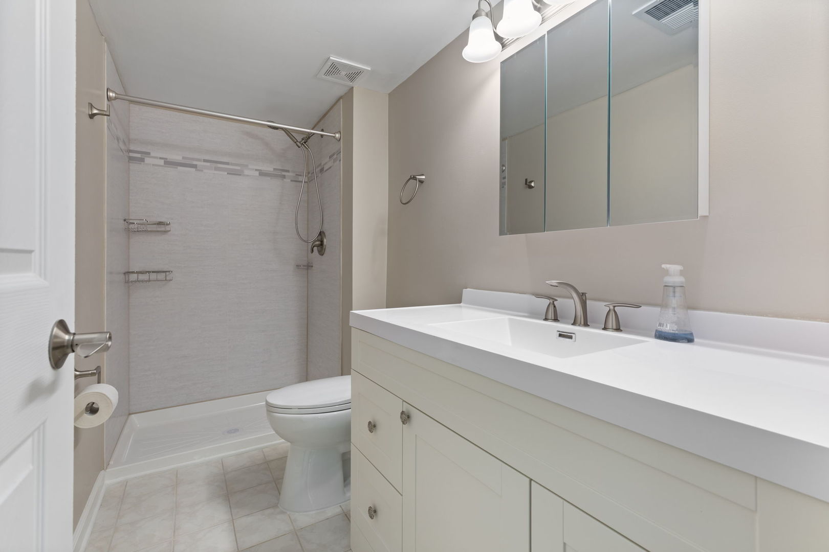 11134 NW Road, Unit 2C Palos Hills, IL 60465 - Photo 15 of 24 a bathroom with a sink a toilet and shower