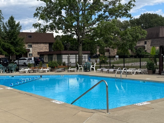 11134 NW Road, Unit 2C Palos Hills, IL 60465 - Photo 23 of 24 a view of swimming pool with outdoor seating and plants