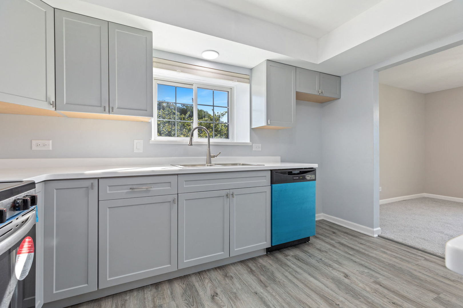11134 NW Road, Unit 2C Palos Hills, IL 60465 - Photo 7 of 24 a kitchen with stainless steel appliances granite countertop a sink and wooden cabinets