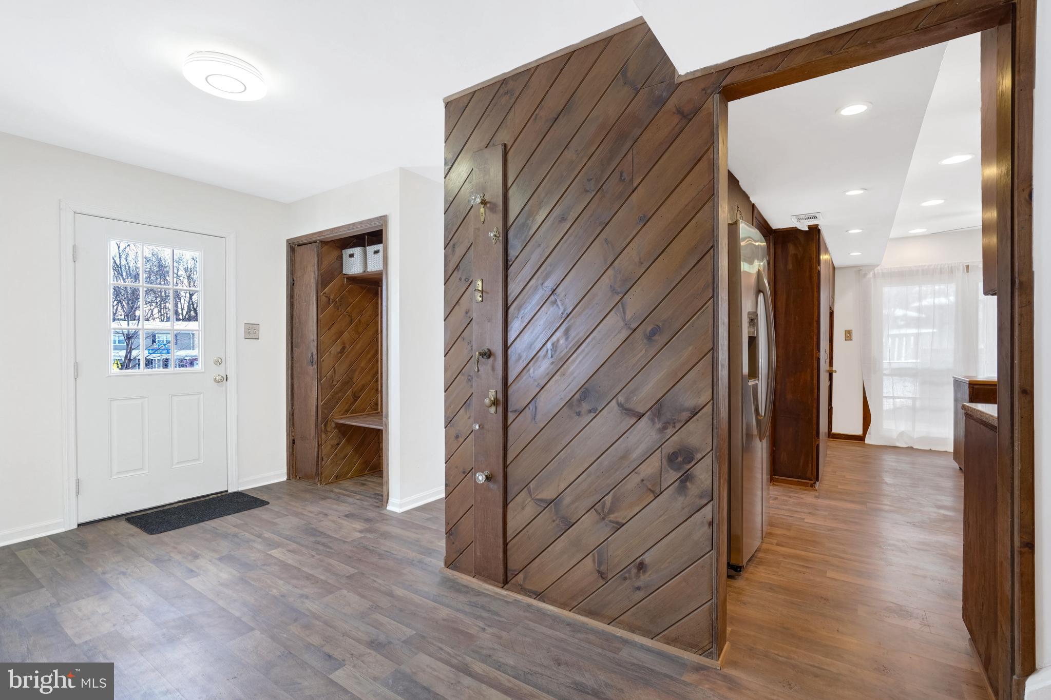 6710 Red Jacket Road Springfield, VA 22152 - Photo 22 of 53 a view of hallway with stairs and wooden floor