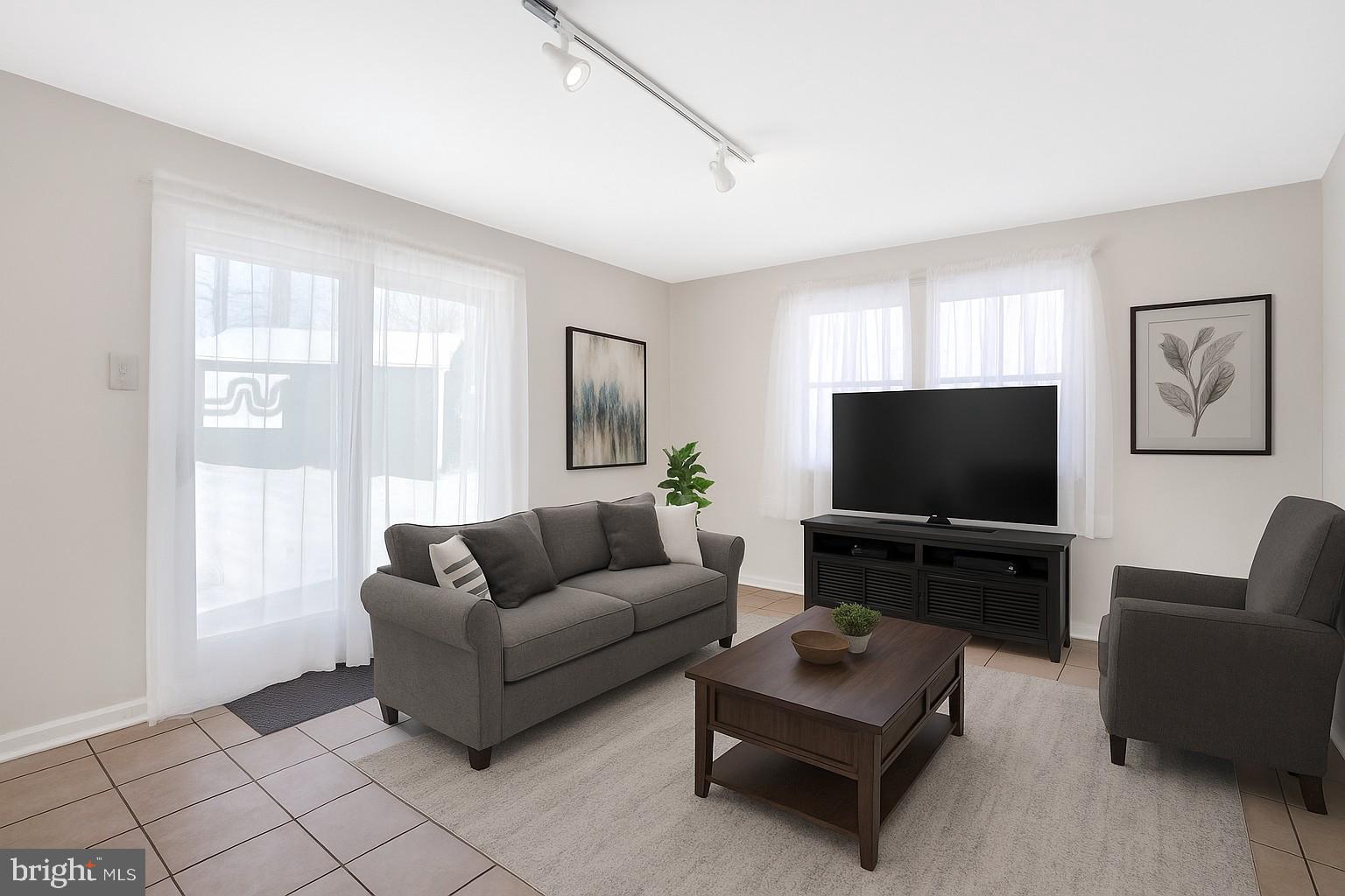 6710 Red Jacket Road Springfield, VA 22152 - Photo 24 of 53 a living room with furniture and a flat screen tv