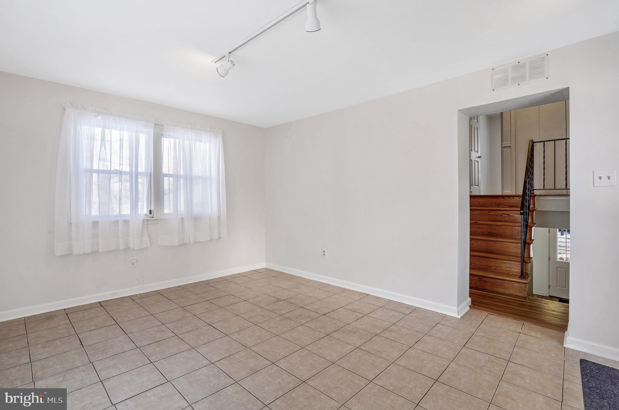 6710 Red Jacket Road Springfield, VA 22152 - Photo 25 of 53 a view of an empty room with window and cabinet area