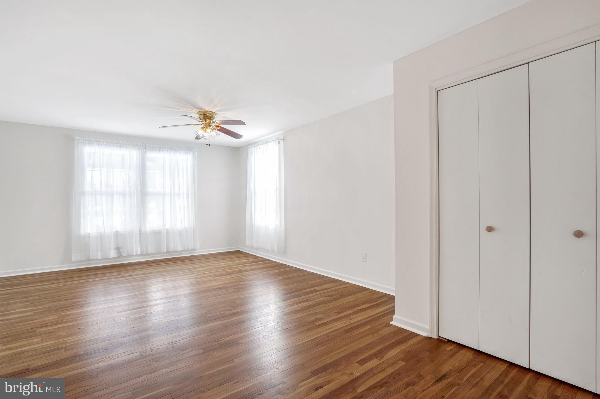 6710 Red Jacket Road Springfield, VA 22152 - Photo 31 of 53 a view of wooden floor and windows in a room