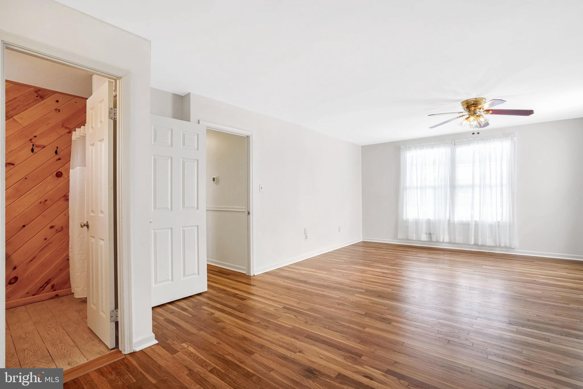 6710 Red Jacket Road Springfield, VA 22152 - Photo 34 of 53 a view of an empty room with wooden floor and a window