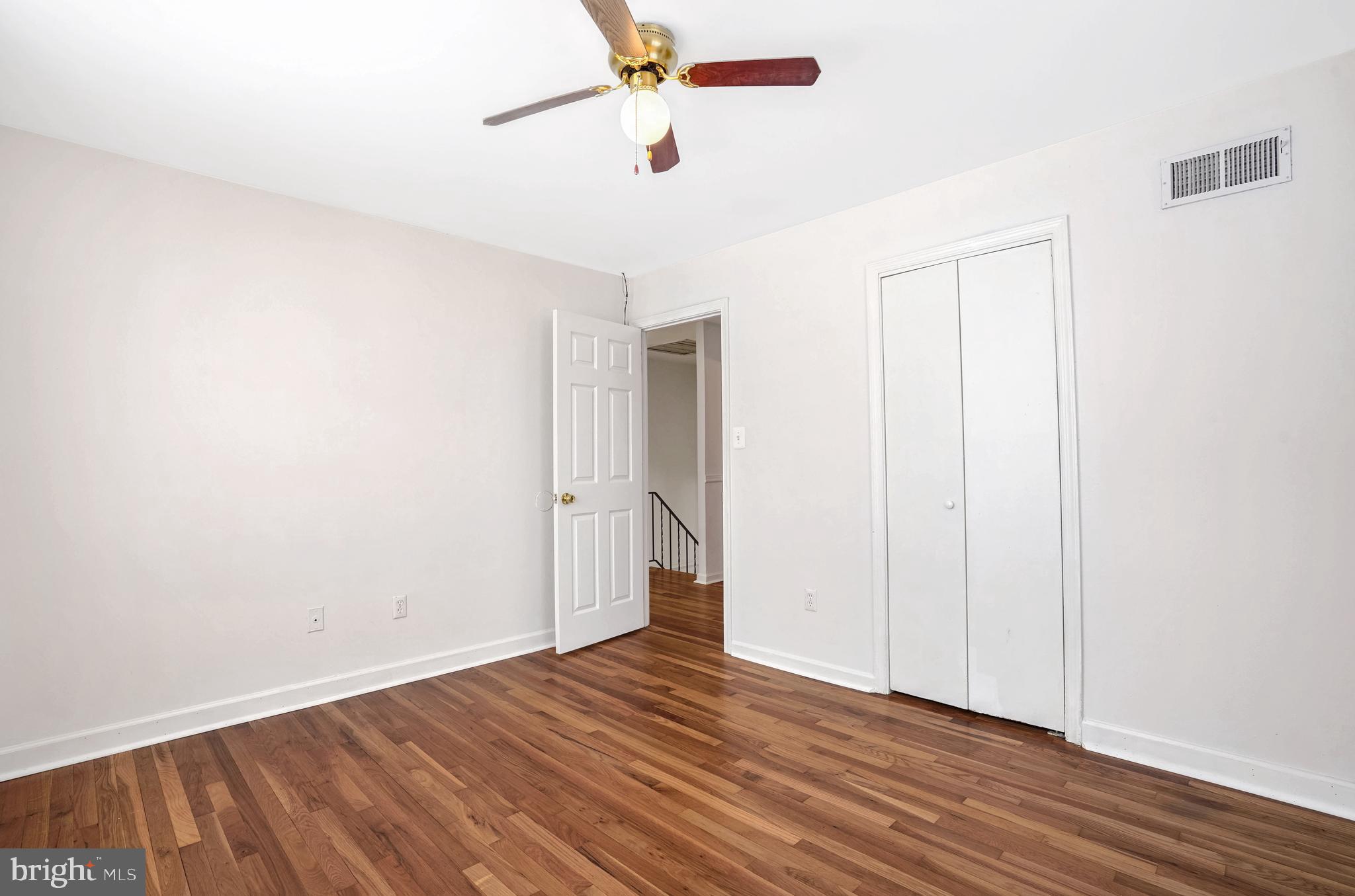6710 Red Jacket Road Springfield, VA 22152 - Photo 39 of 53 a view of an empty room with wooden floor
