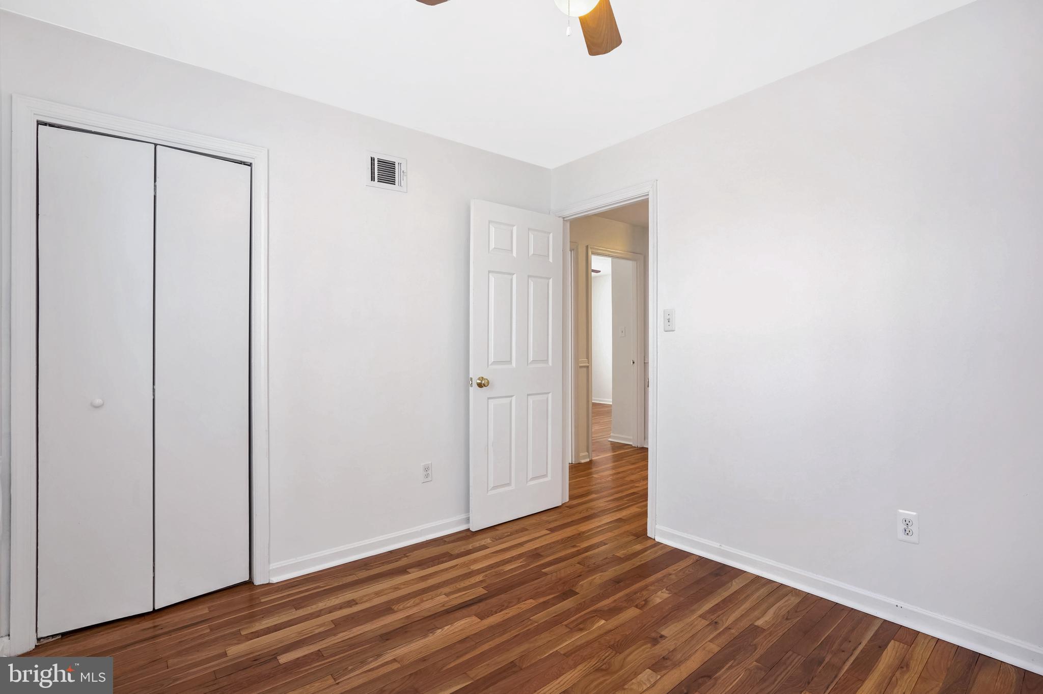 6710 Red Jacket Road Springfield, VA 22152 - Photo 44 of 53 a view of an empty room with wooden floor
