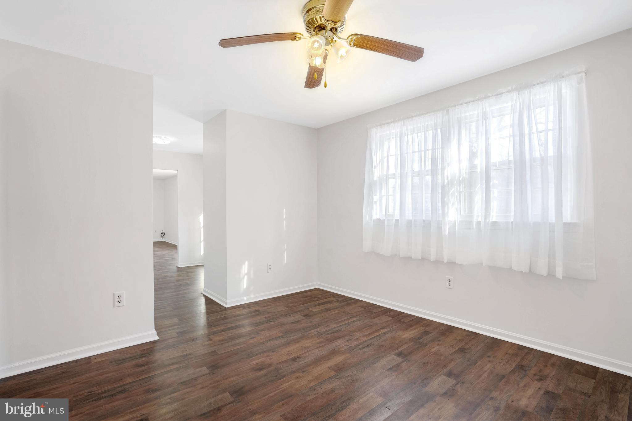 6710 Red Jacket Road Springfield, VA 22152 - Photo 8 of 53 wooden floor in an empty room with a window