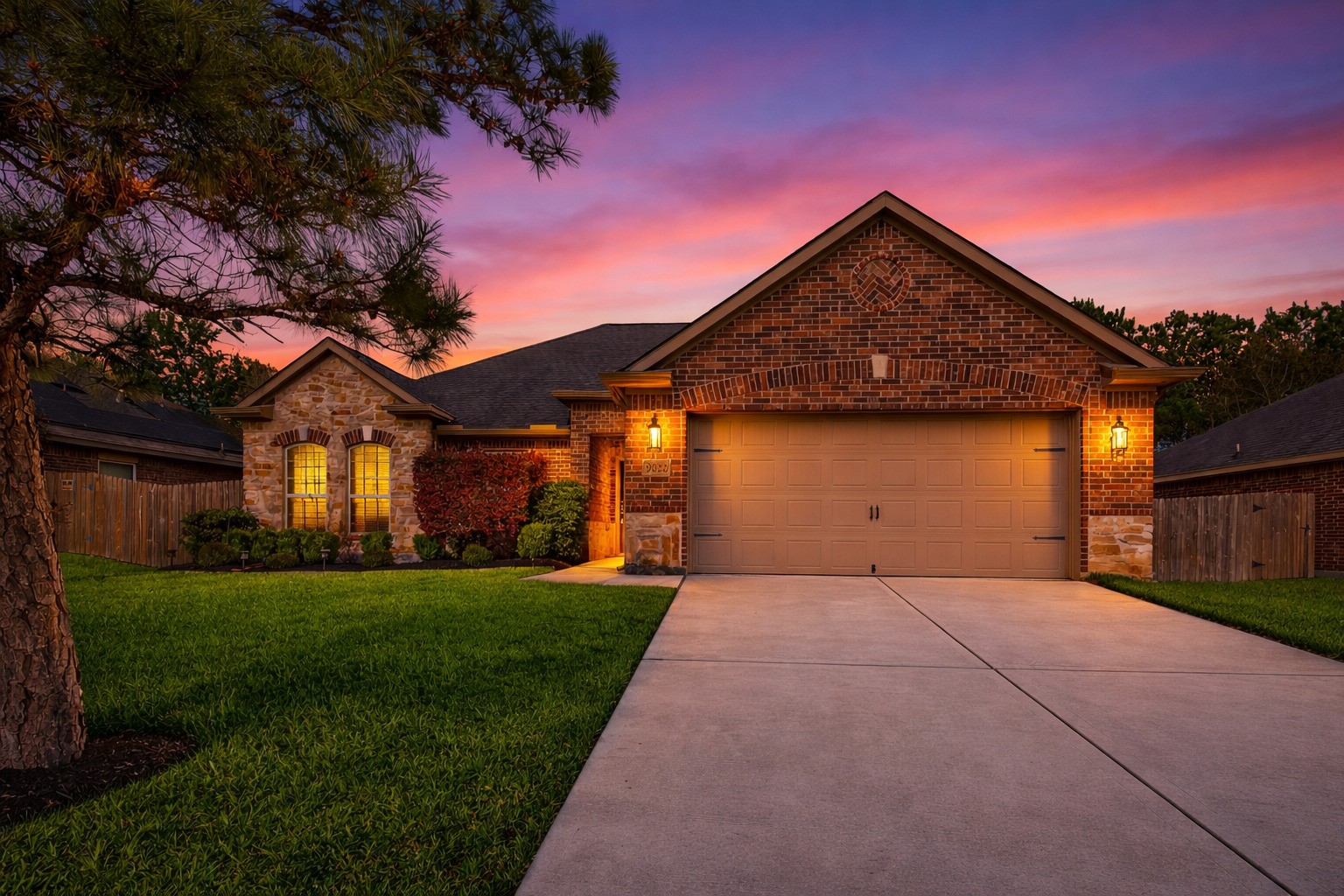 9022 Nina Road Conroe, TX 77304 - Photo 1 of 13 A warm, glowing welcome—this beautifully lit exterior creates an inviting first impression the moment you arrive.