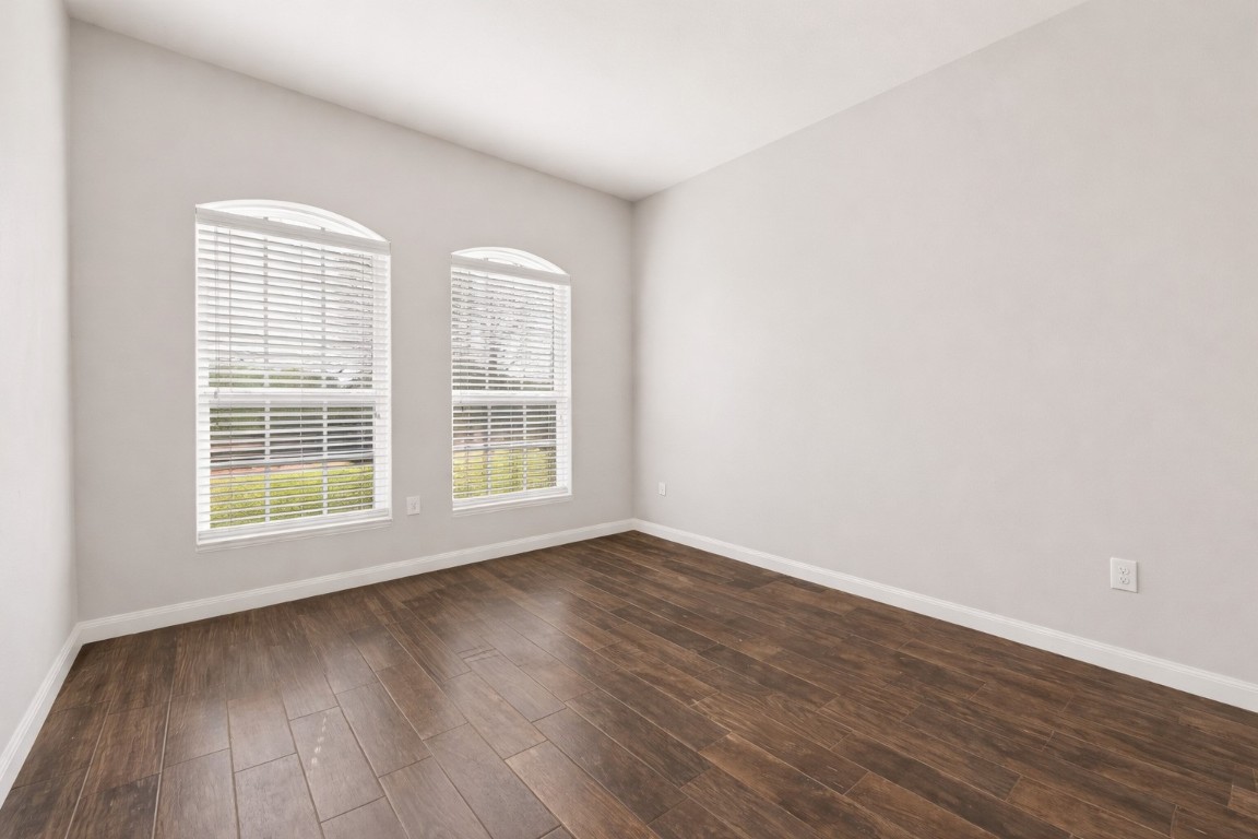 9022 Nina Road Conroe, TX 77304 - Photo 12 of 13 Bright windows and warm flooring create a cheerful, comfortable space ready to fit your needs.