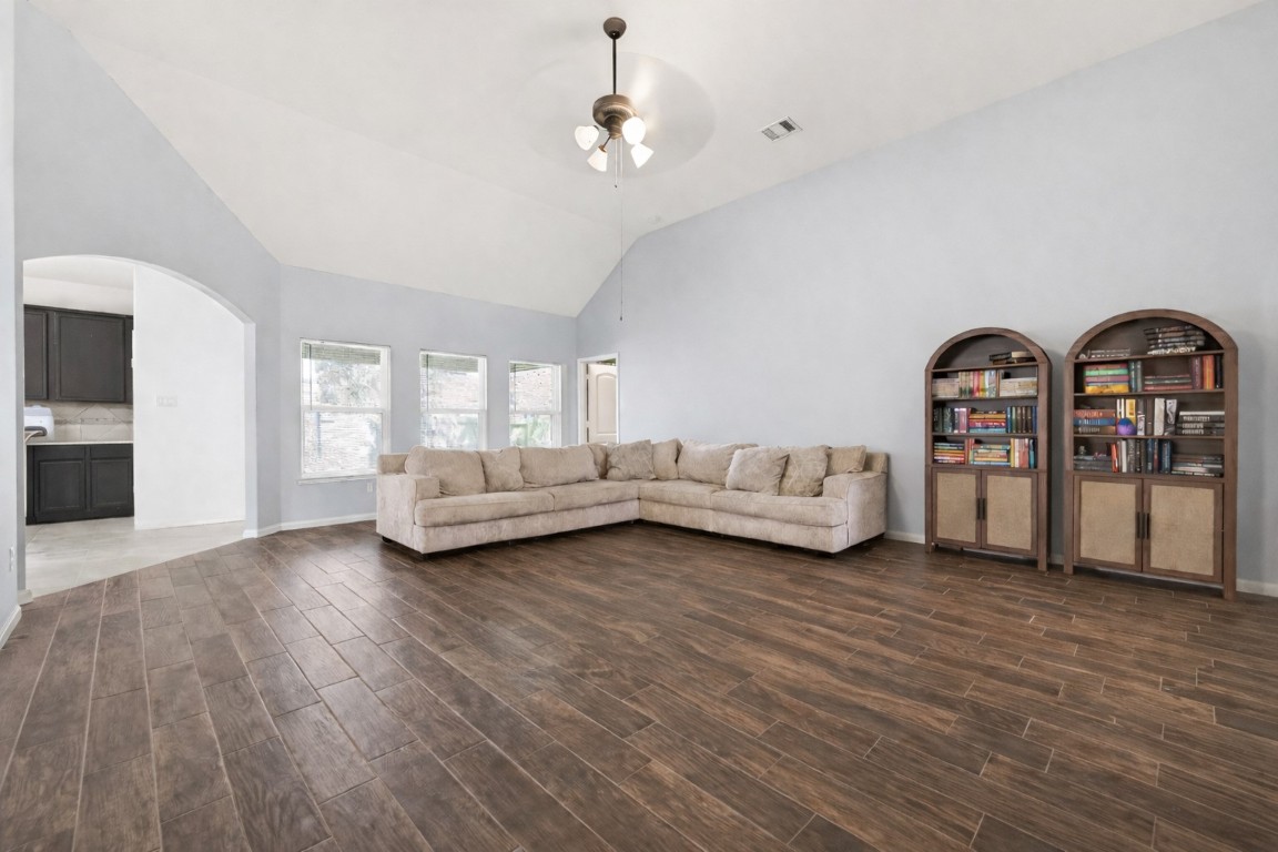 9022 Nina Road Conroe, TX 77304 - Photo 4 of 13 Spacious yet cozy, this living area offers a seamless flow and a calming, neutral backdrop.