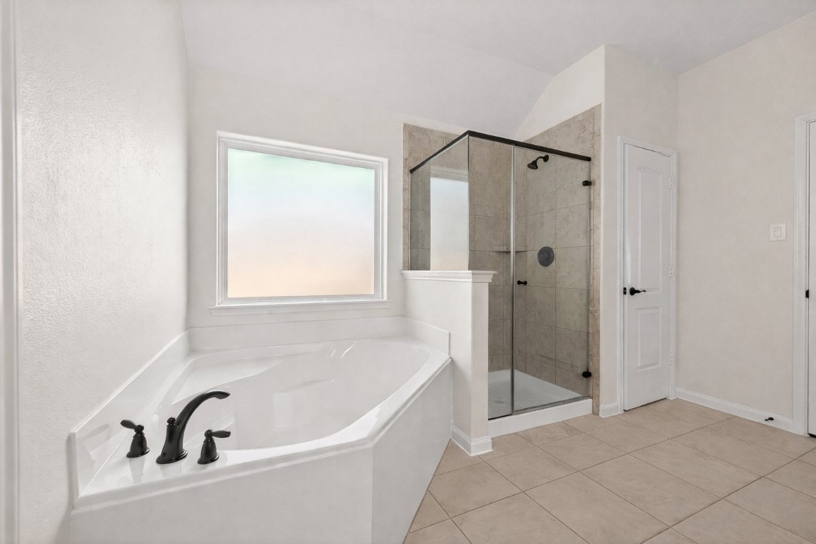 9022 Nina Road Conroe, TX 77304 - Photo 9 of 13 Spa-inspired and serene, featuring a soaking tub, separate shower, and room to relax and recharge.