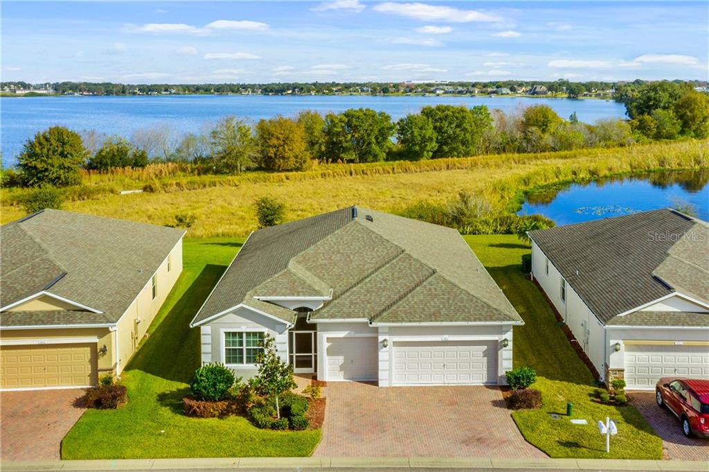 SITED ON A PREMIUM LOT OFFERING VIEWS OF BOTH THE LAKE AND POND