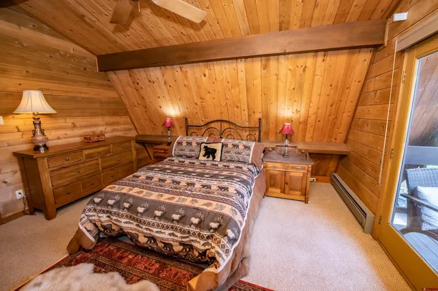 a bed sitting in a room next to a window