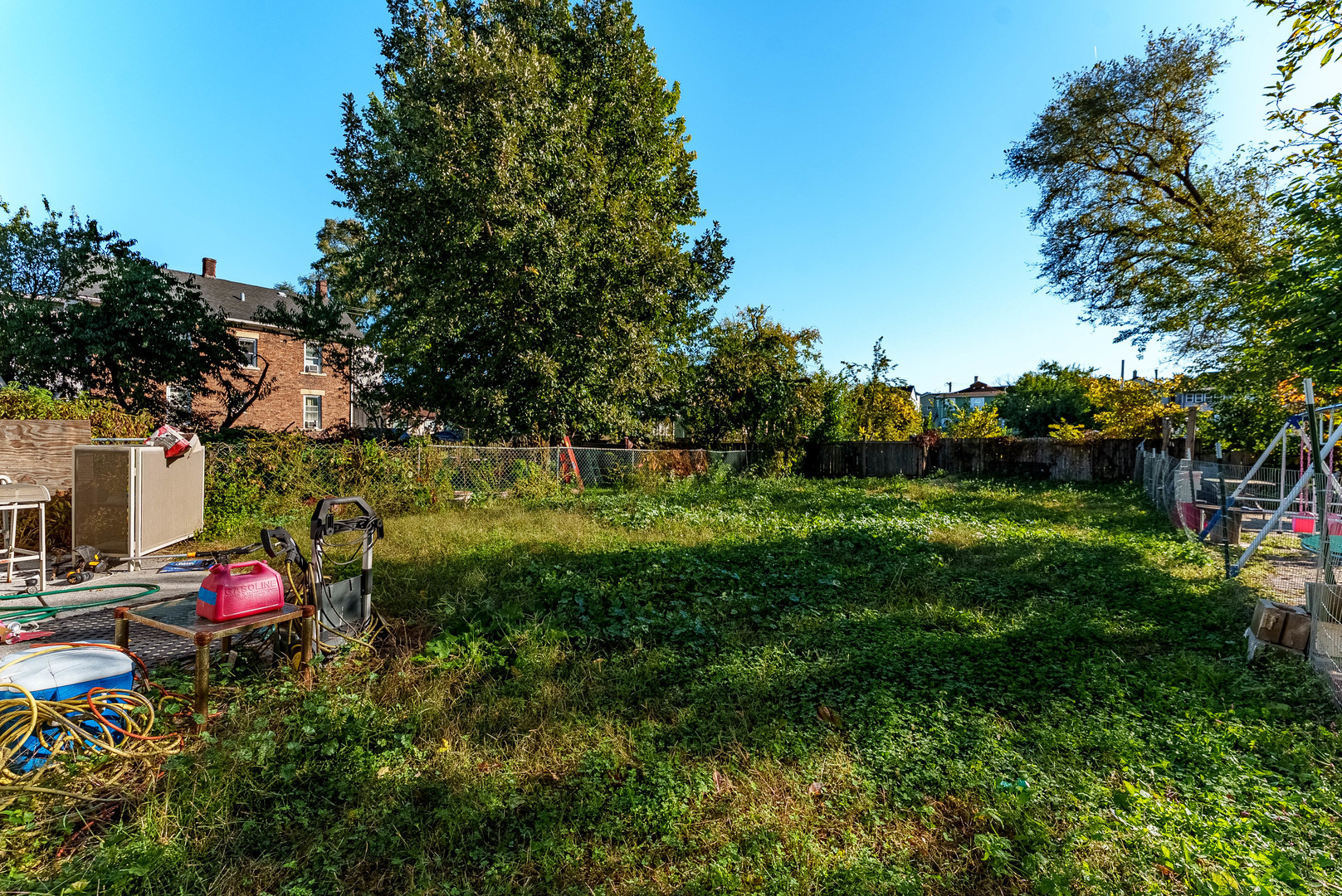 256 Mc Roberts Street Joliet, IL 60432 - Photo 13 of 14 a view of a kids room with a lot of flower plants and large trees