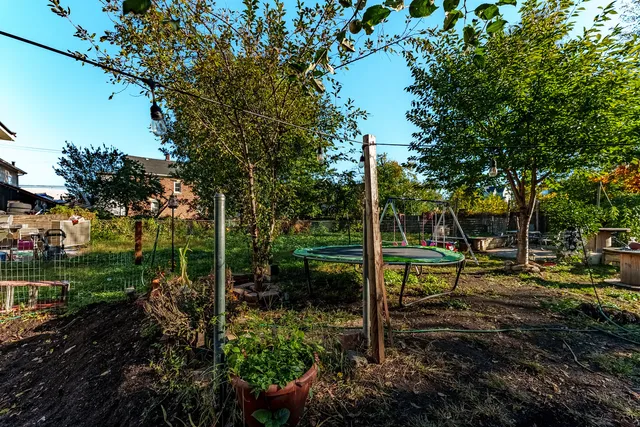 a view of a backyard with sitting area