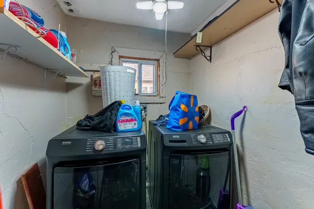 a bathroom with a granite countertop sink a toilet and mirror