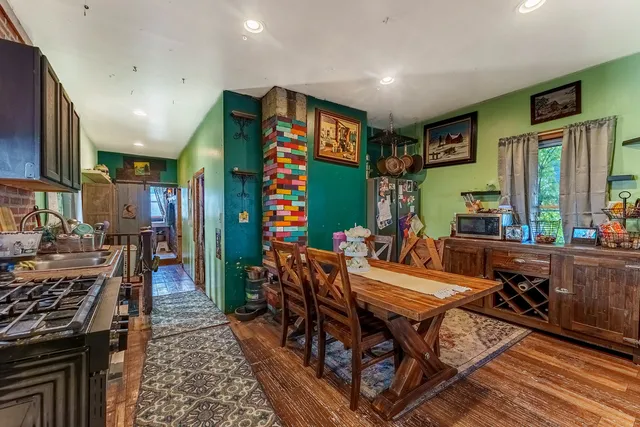 a view of a dining room with furniture window and wooden floor