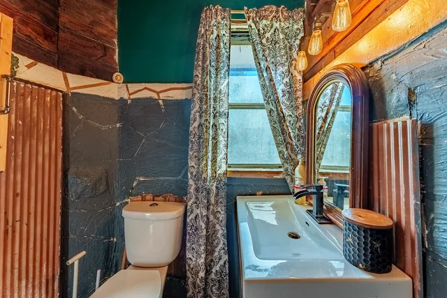 a view of a bathroom with a toilet and a sink