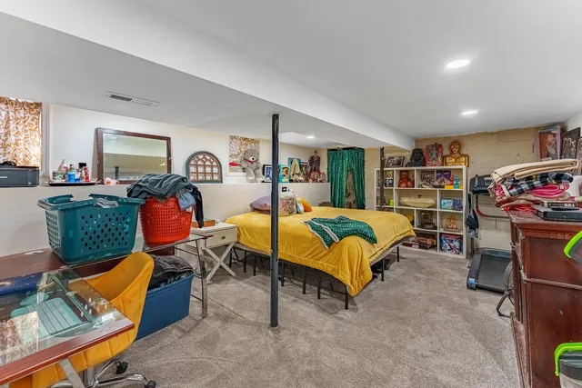 a bed room with a bed and a television