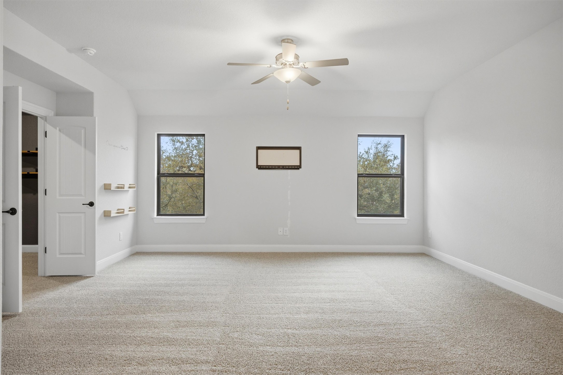 208 Tovas Secret Cove Georgetown, TX 78628 - Photo 20 of 40 an empty room with windows and fan