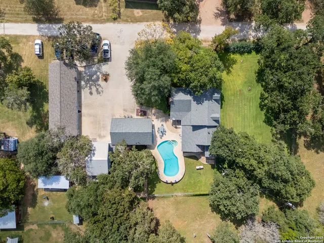 a view of outdoor space with swimming pool and trees
