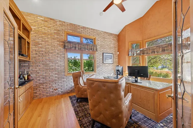 a room with patio furniture and a fireplace