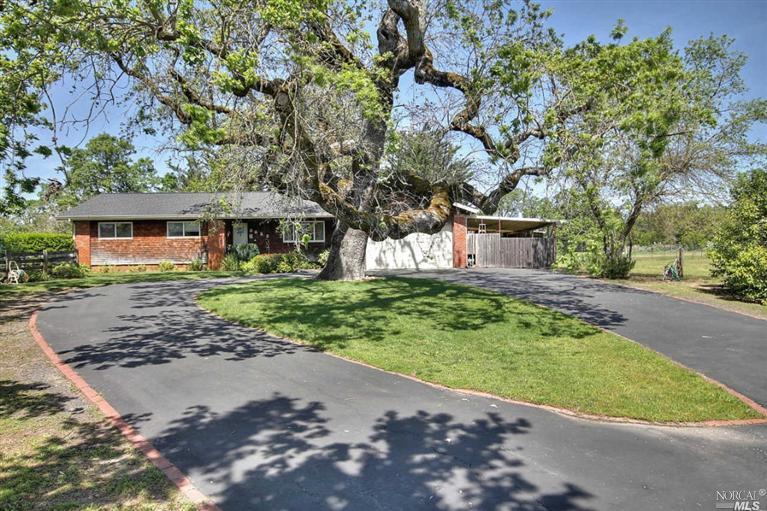 3823 Guerneville Road Santa Rosa, CA 95401 - Photo 1 of 1 a front view of a house with a garden